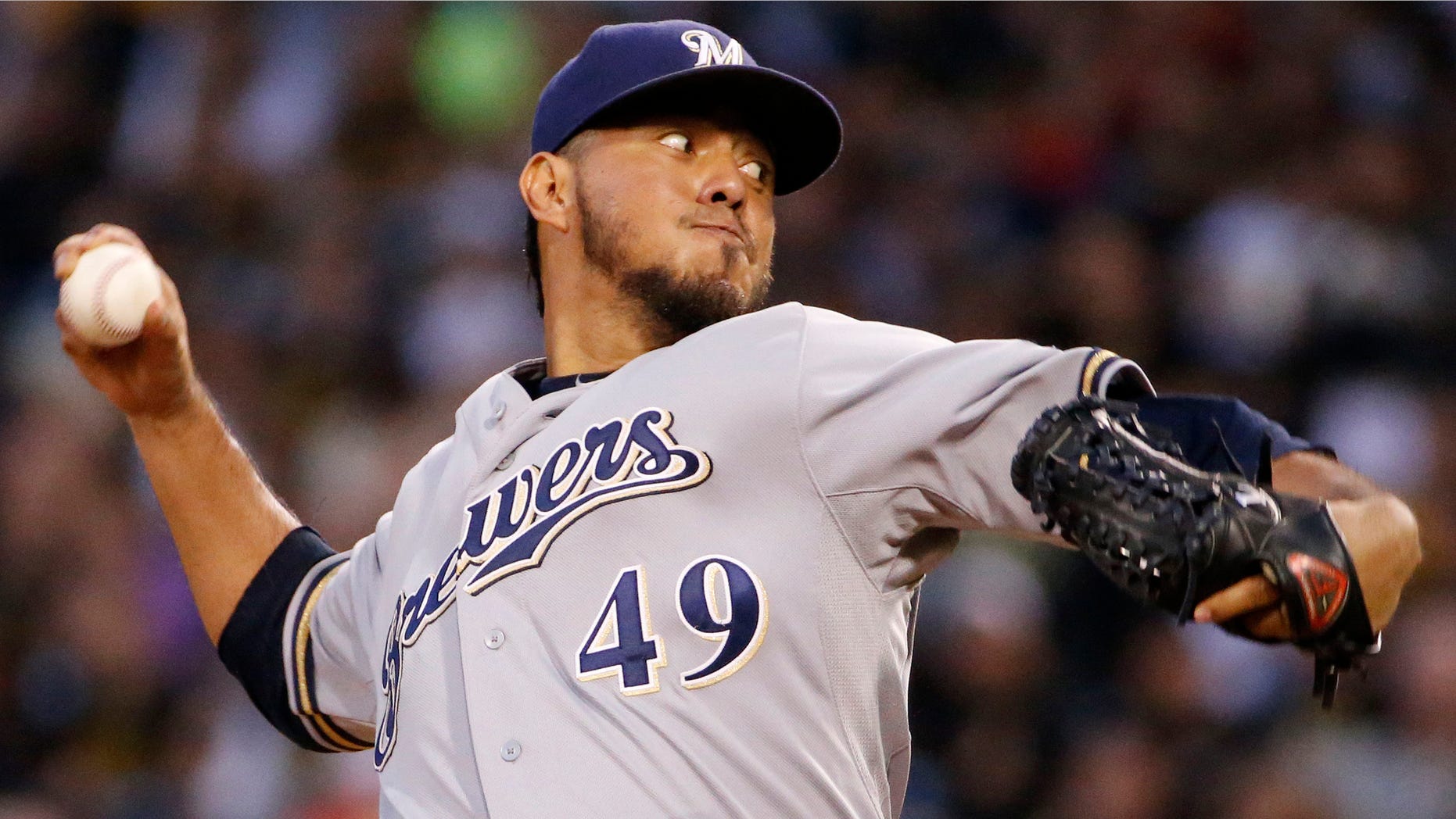FILE - In this Sept. 19, 2014, file photo, Milwaukee Brewers starting pitcher Yovani Gallardo delivers during the first inning of a baseball game against the Pittsburgh Pirates in Pittsburgh. A person familiar with the deal told The Associated Press, Monday, Jan. 19, 2015, the Milwaukee Brewers have agreed to trade starter Gallardo to the Texas Rangers. (AP Photo/Gene J. Puskar, File)