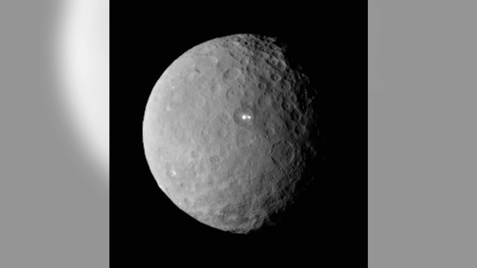 Two of the bright spots seen on Ceres are close together in a crater.