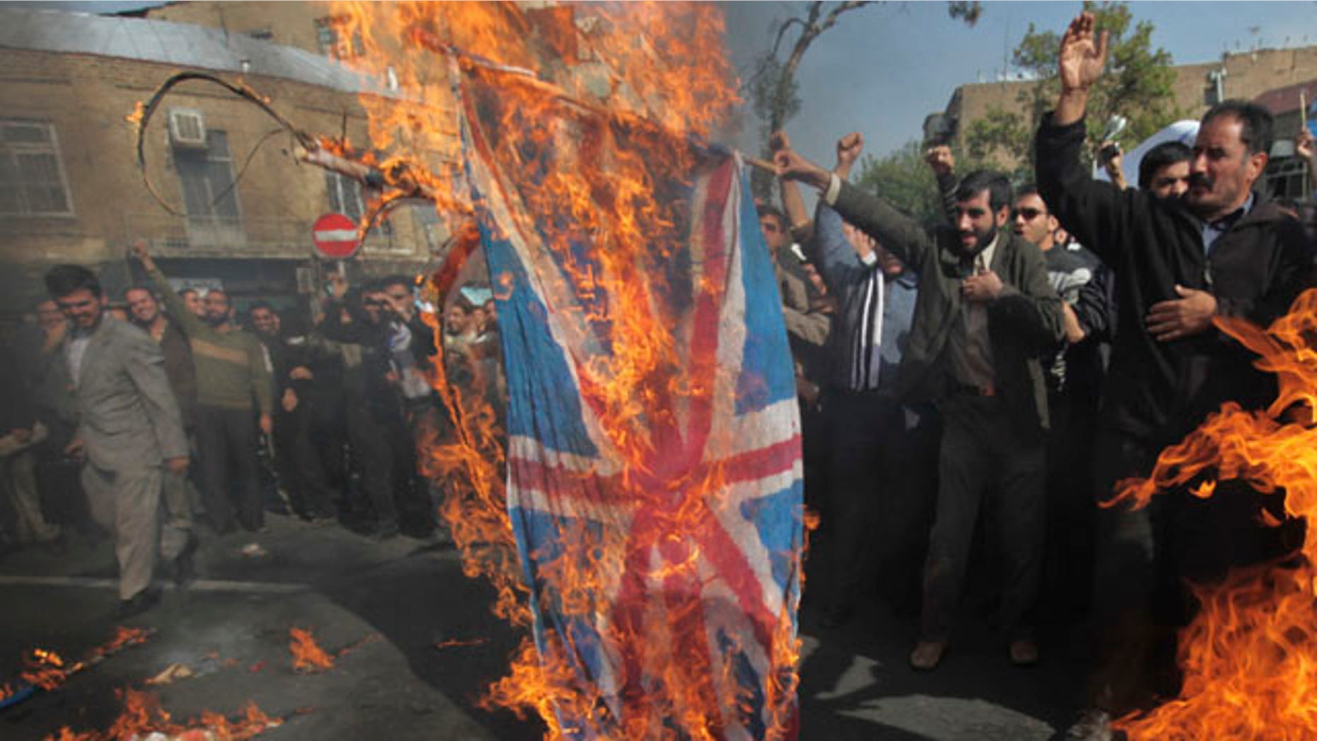 Nov. 4: Iranian protestors burn representative of the British flag during an anti-British demonstration in front of the British Embassy in Tehran, Iran.
