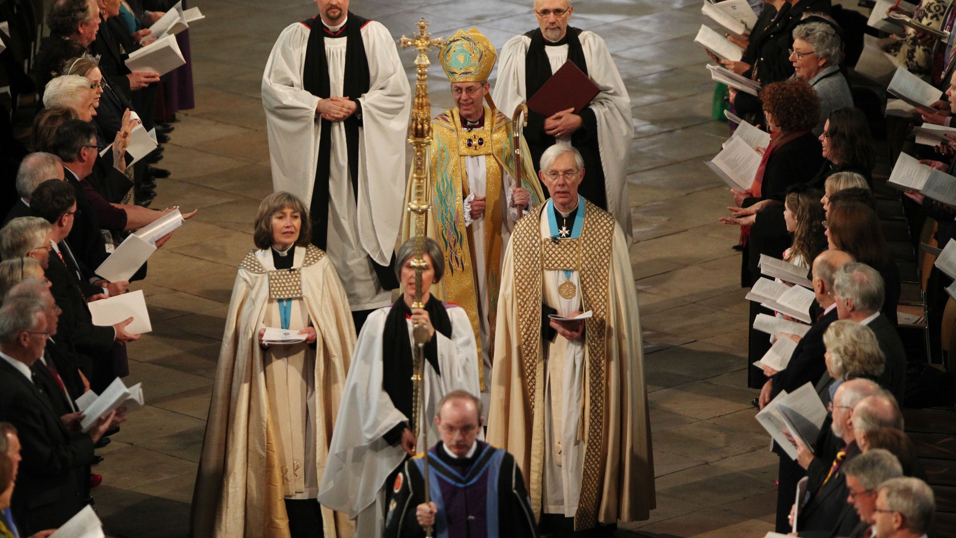 March 21, 2013: The new Archbishop of Canterbury Justin Welby, centre, arrives for his enthronement service at Canterbury Cathedral in Canterbury England.