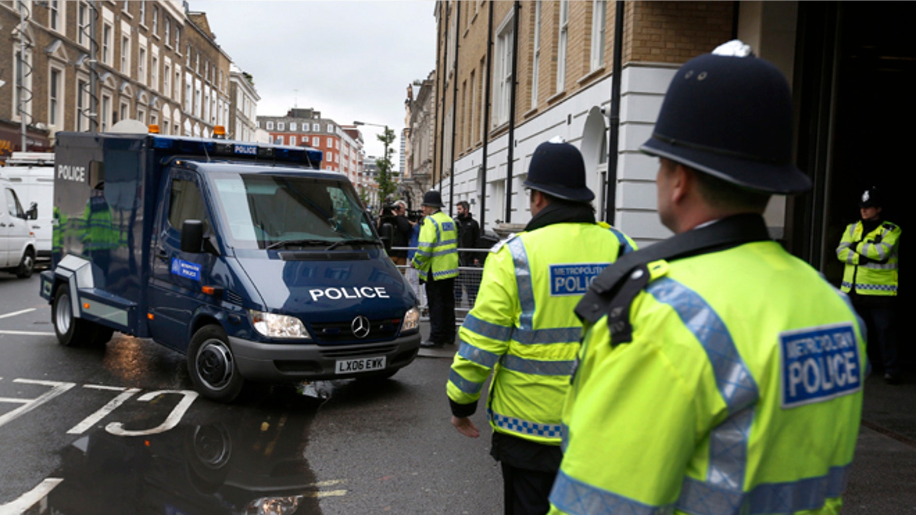 May 30, 2013: A police van allegedly carrying 22-year-old Michael Adebowale, a suspect in the murder of British soldier Lee Rigby, enters the Westminster Magistrates Court in central London. Adebowale was charged late Wednesday by counterterrorism officers and will appear in court on Thursday, police said.
