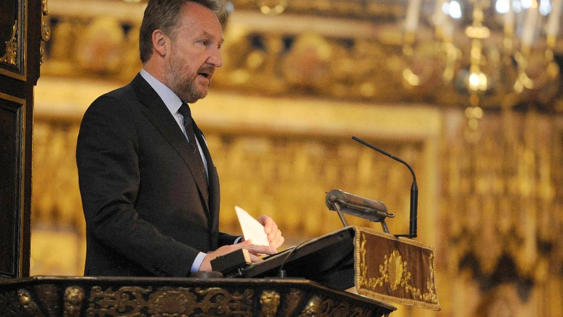The Muslim Bosniak member of Bosnia's tripartite presidency Bakir Izetbegovic speaks during a memorial service at Westminster Abbey, London, to mark the upcoming 20th anniversary of the Srebrenica massacre Monday July 6, 2015. Days before anniversary of the Srebrenica massacre, hundreds of Bosnians and Britons attended the memorial service at Westminster Abbey on Monday to remember the more than 8,000 male Muslim victims. (Lauren Hurley/PA via AP) UNITED KINGDOM OUT