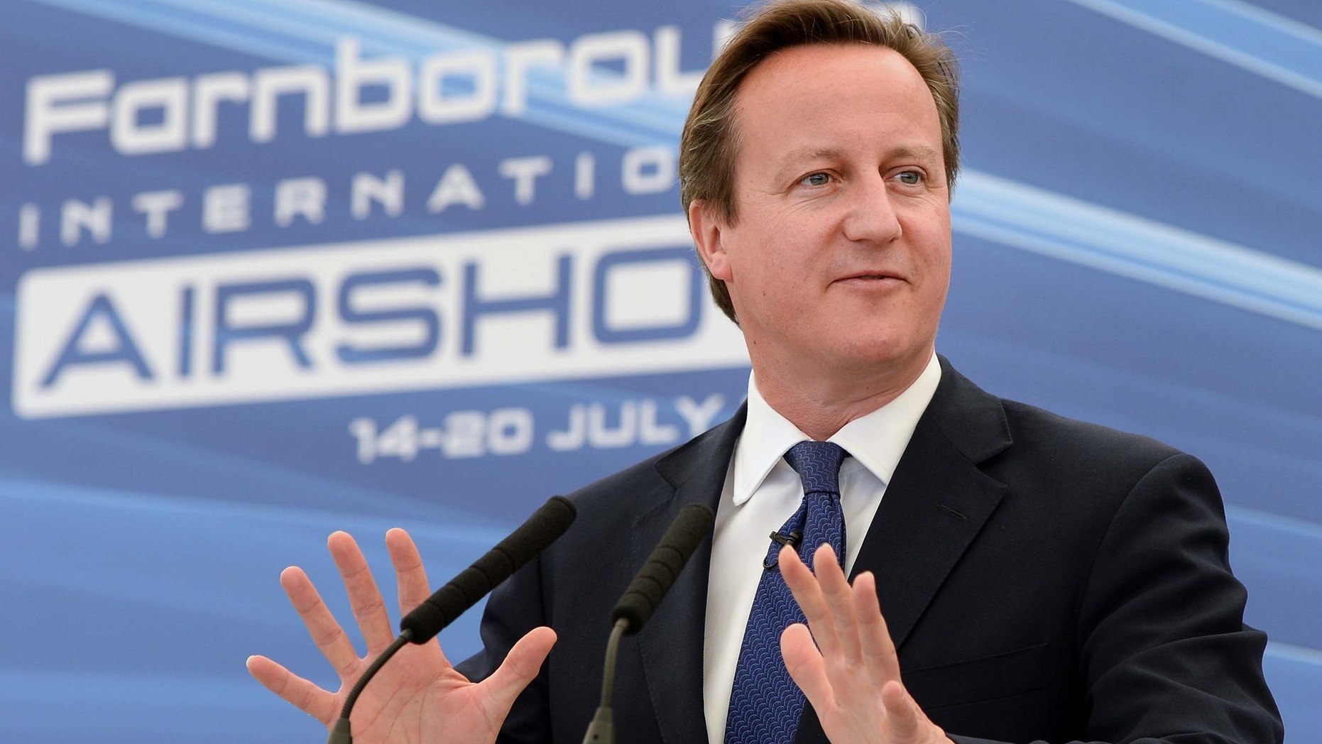 B July 14, 2014 - FILE photo of Britain's Prime Minister David Cameron, during a visit to the 2014 Farnborough Airshow, in Hampshire, England. Pressure is mounting for Cameron to do more on Iraq, with some members of his own party urging him to recall Parliament from its summer break to consider action against Islamic militants.