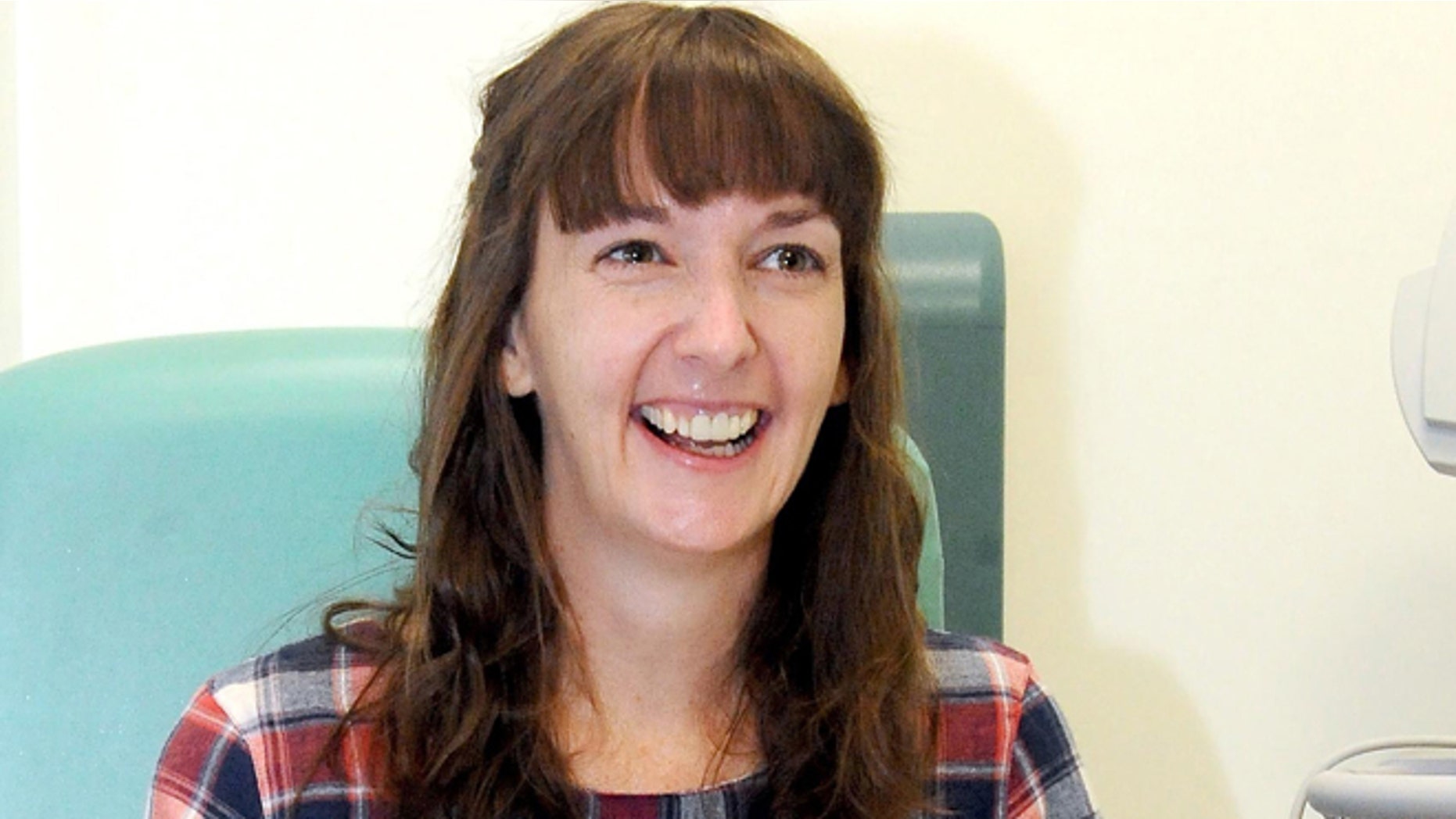 In this file photo, Pauline Cafferkey, a nurse who contracted Ebola while working in Sierra Leone, smiles in the Royal Free Hospital in London.