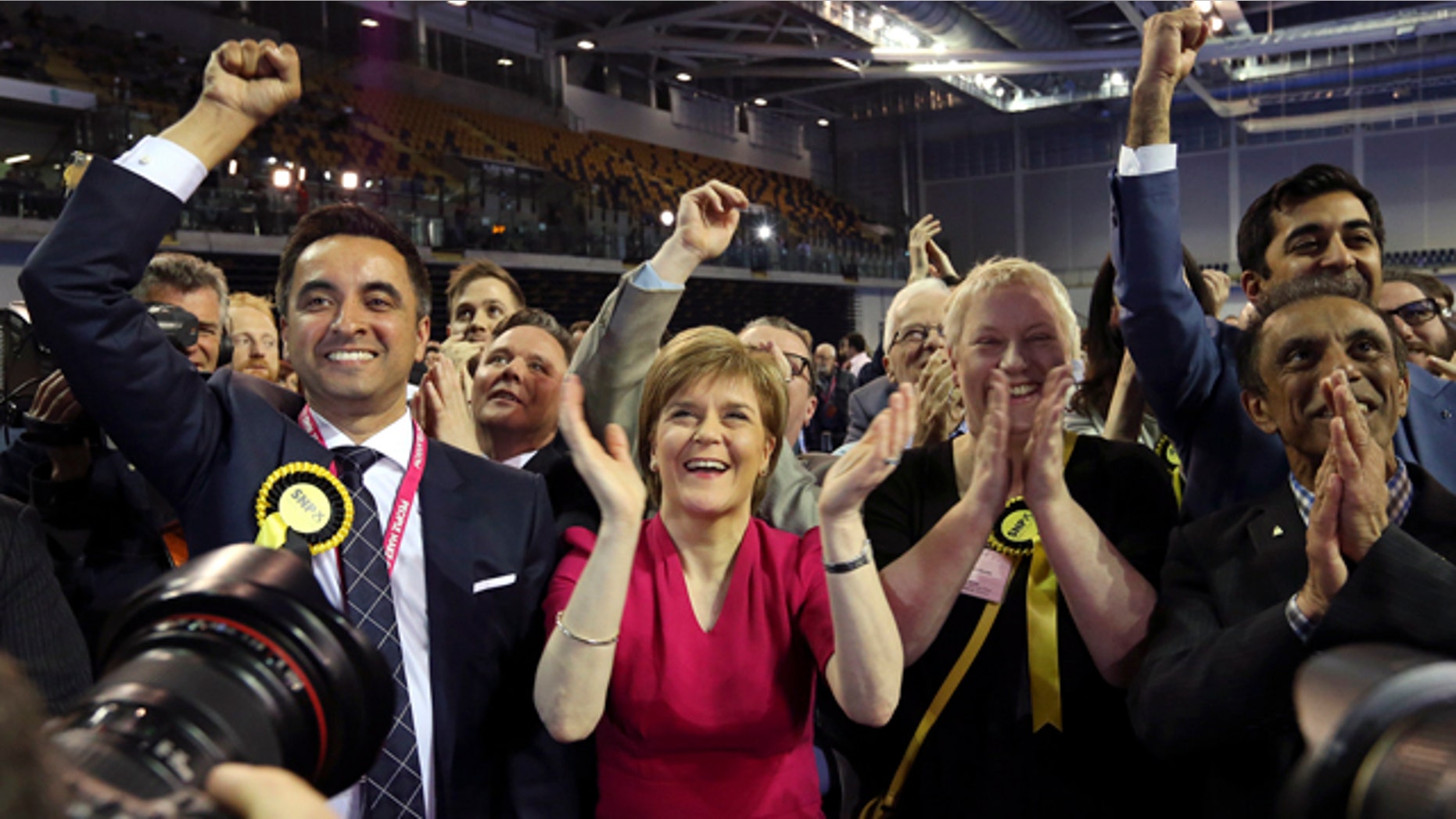 May 8, 2015: First Minister of Scotland and Scottish National Party leader Nicola Sturgeon, center, celebrates with the results for her party at the count of Glasgow constituencies for the general election. (AP Photo/Scott Heppell)