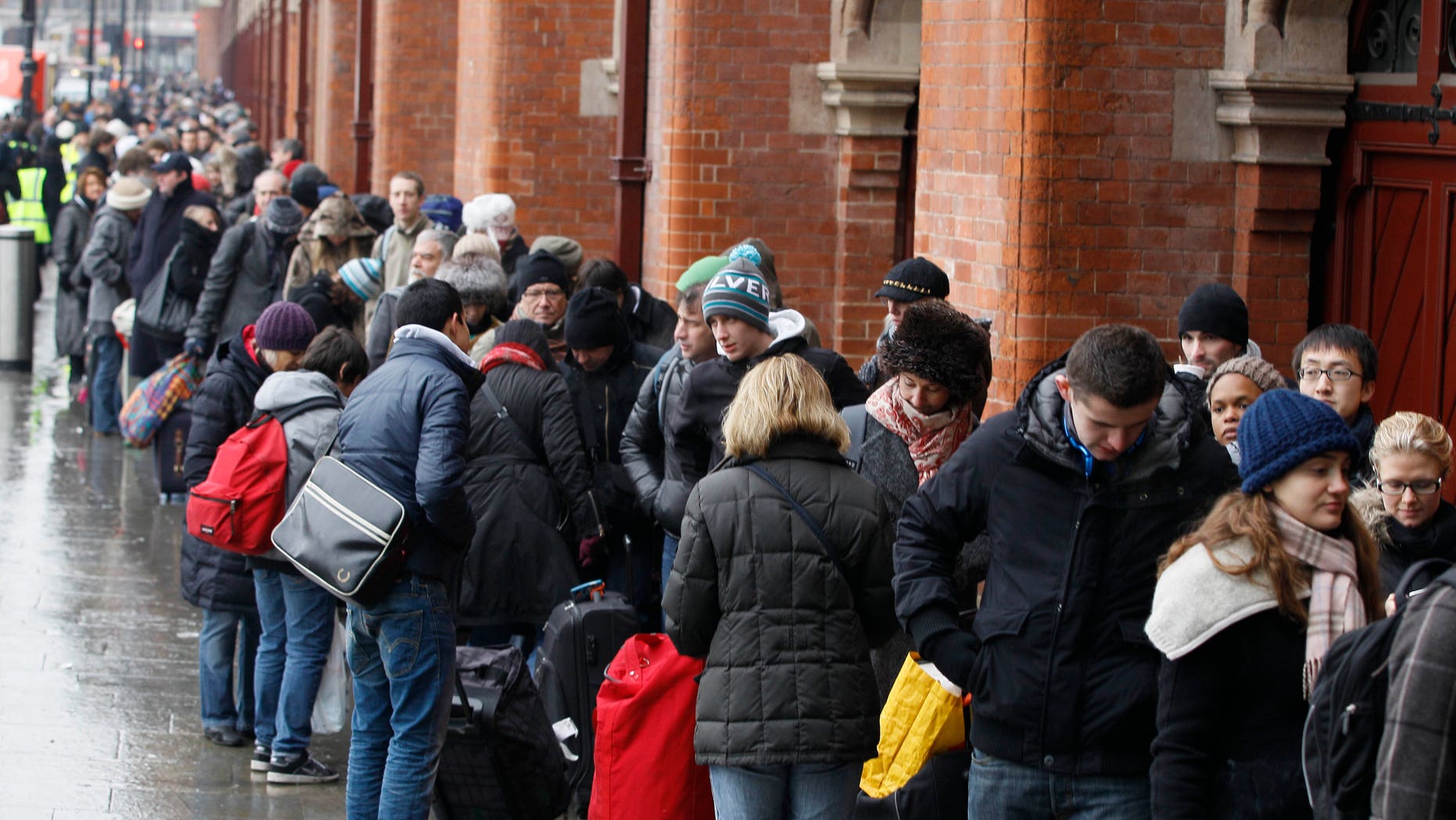 Passengers queue for Eurostar trains at St Pancras station in London, Tuesday, Dec. 21, 2010. Major delays and cancellations caused by cold and snow disrupted European airports including London's Heathrow, and the Eurostar train link, leaving thousands stranded across Europe as Christmas approached
