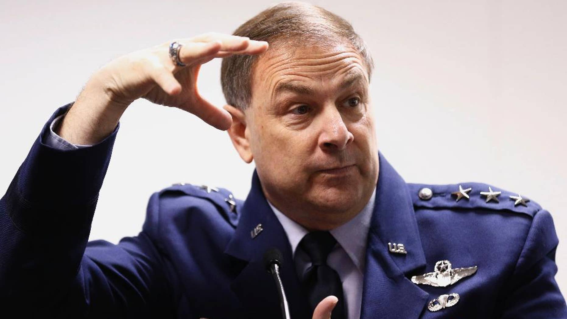 United States Air Force Lt. Gen Chris Bogdan, Program Executive Officer for the F-35 Lightning II Joint Program Office, updates the media on Lockheed Martin’s F-35 Lightning II fighter jet during a news conference at Farnborough International Air Show, Farnborough, England, Monday, July 14, 2014. (AP Photo/Sang Tan)