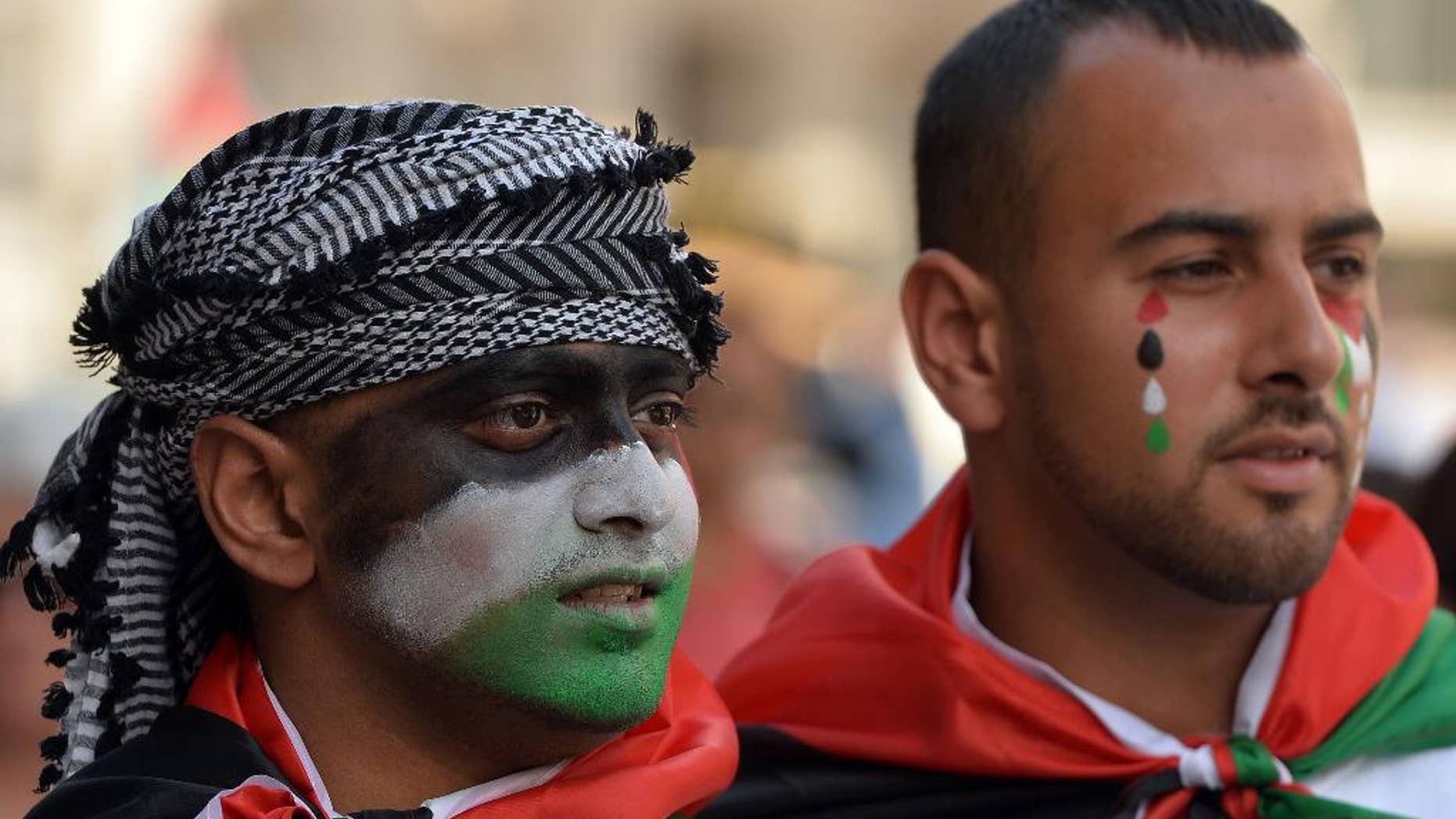 Protesters against military action in Gaza gather by the BBC building in central London, Saturday, Aug. 9, 2014. Israeli airstrikes struck more than 20 targets Saturday in the Gaza Strip and killed a senior Hamas member, as militant rocket fire continued following the collapse of a three-day truce aimed at ending the war between Israel and Hamas. (AP Photo/John Stillwell, PA Wire) UNITED KINGDOM OUT - NO SALES - NO ARCHIVES