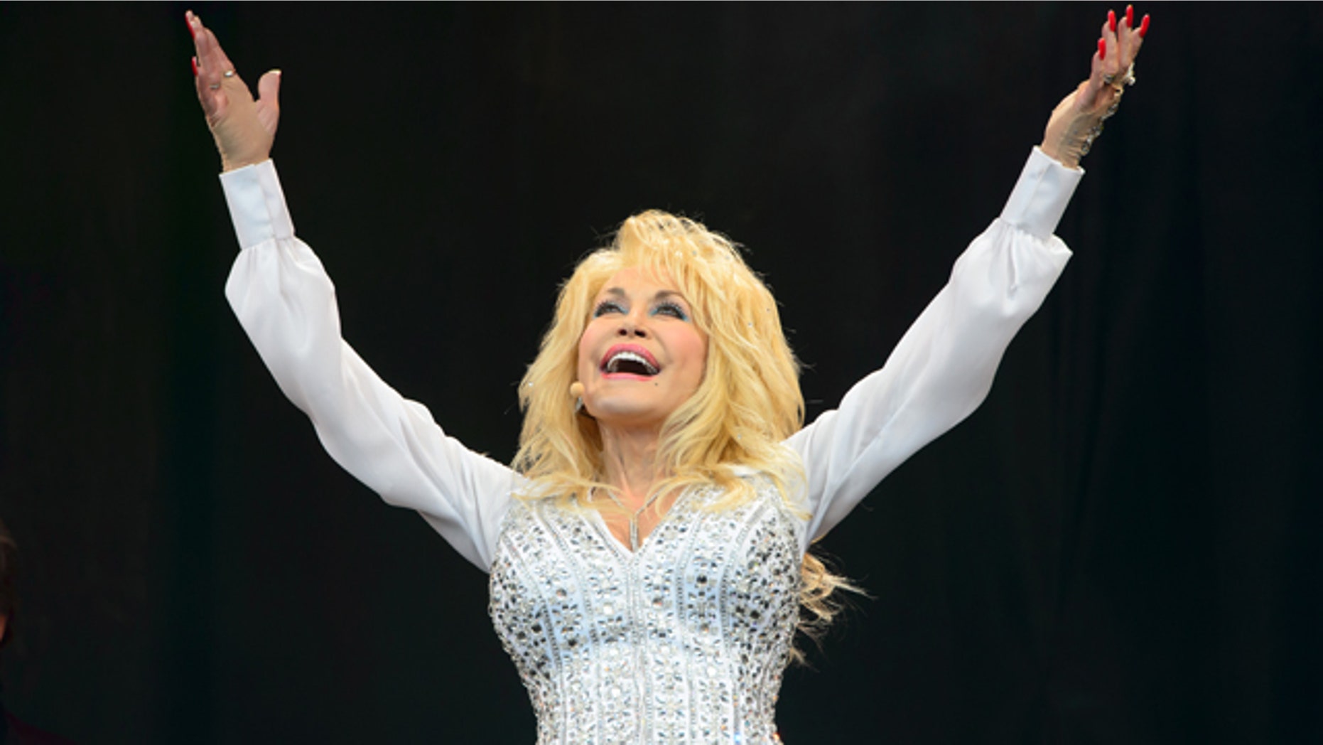 June 29, 2014: Dolly Parton performs at the Glastonbury music festival in England. (Photo by Jonathan Short/Invision/AP)