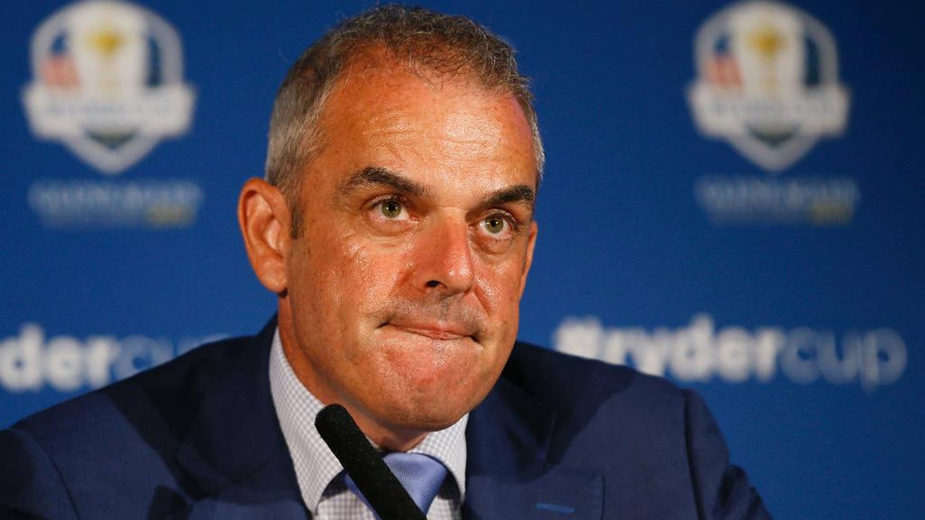 European Ryder cup team captain Paul McGinley listens during a press conference at Wentworth Golf Club to announce his three wild card selections for his team to play at Gleneagles in Scotland against the USA, in Wentworth England, Tuesday, Sept. 2, 2014. (AP Photo/Kirsty Wigglesworth)