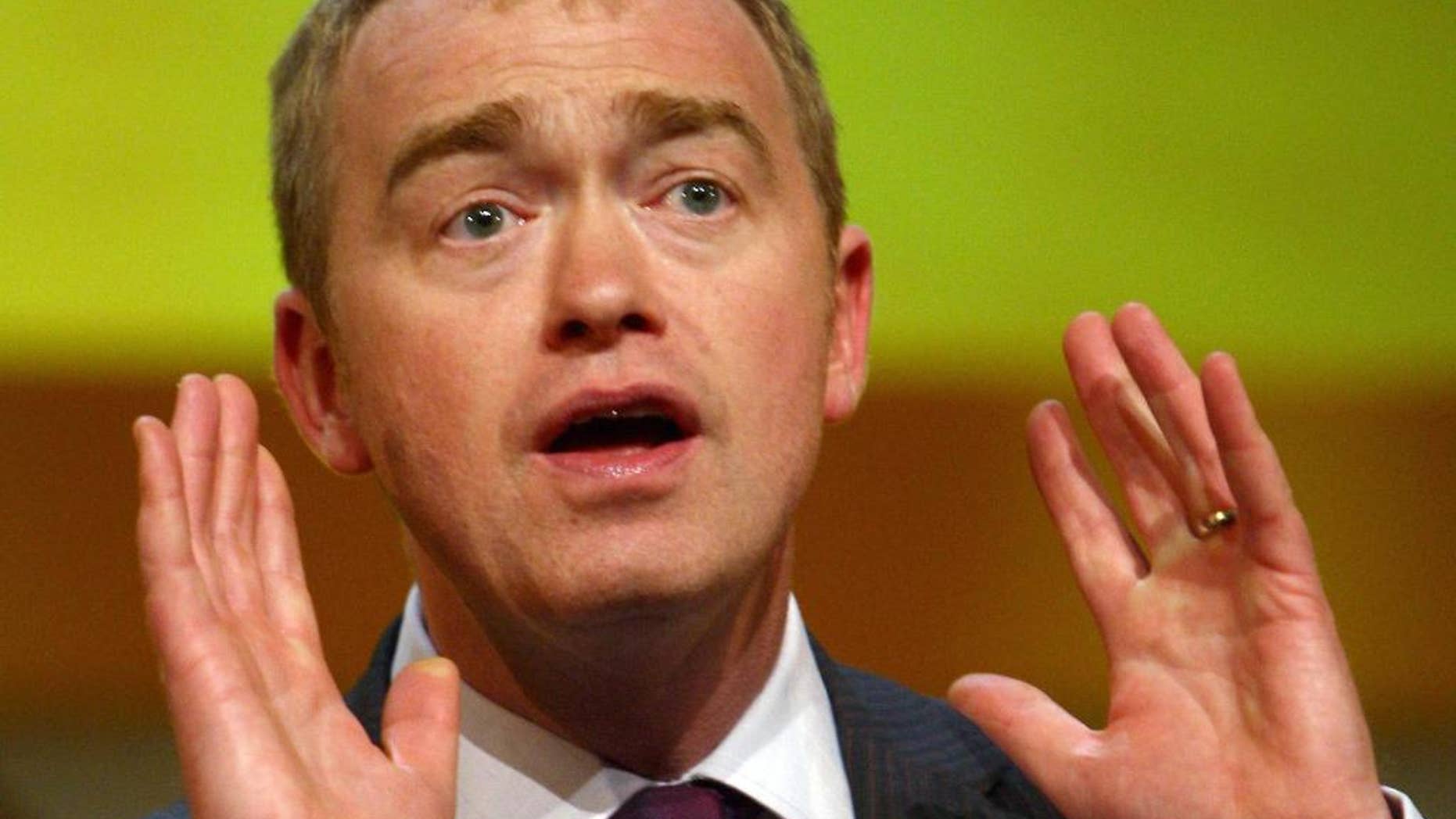 FILE - This is a July 1, 2015 file photo of Liberal Democrat Party politician Tim Farron, speaking in Birmingham England. Britain's centrist Liberal Democrats on Thursday July, 16, 2015 elected Tim Farron, as the party's new leader. (David Jones/PA File Via AP)