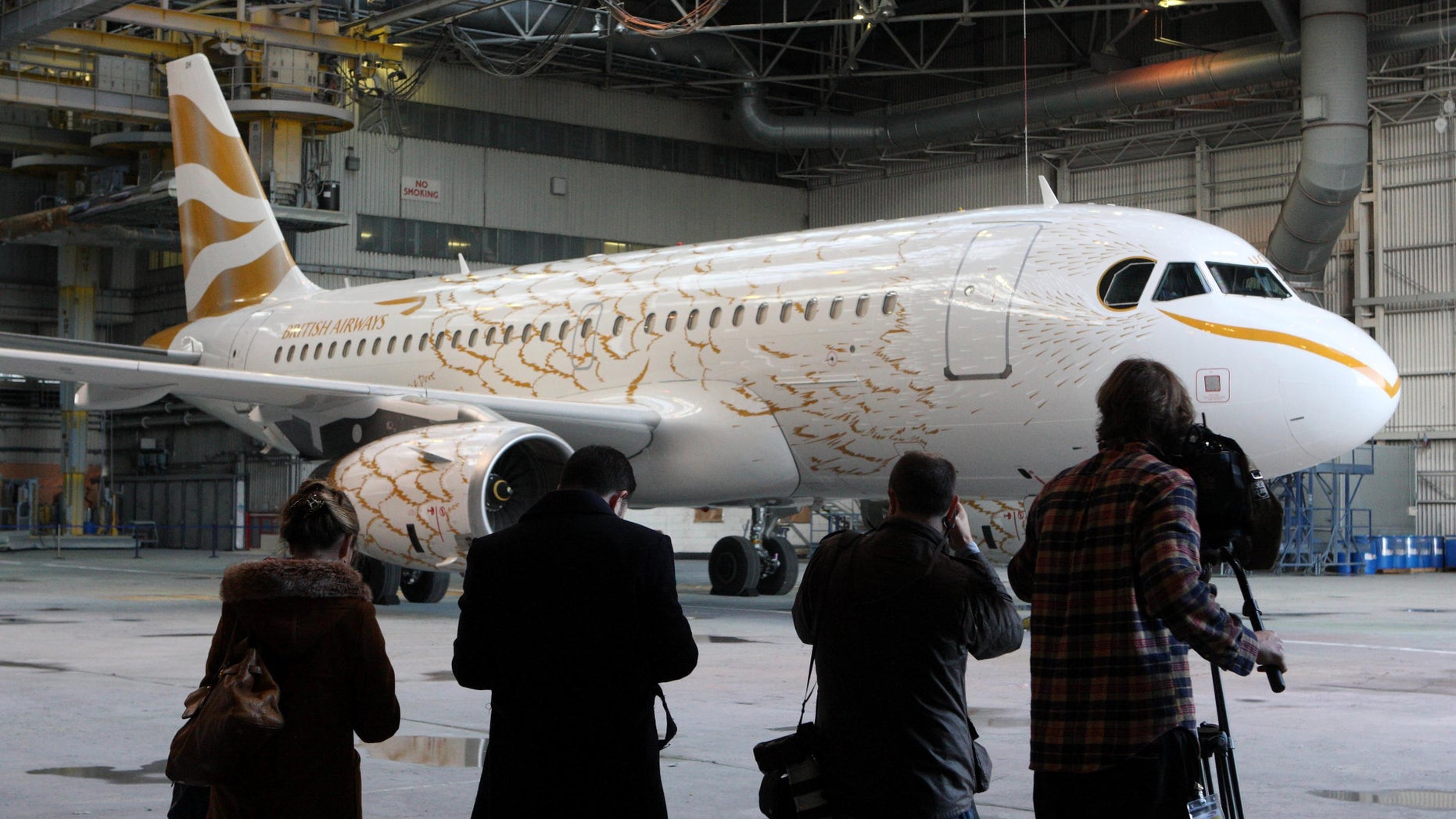April 3: The British Airways Airbus A319, which has been painted to resemble a giant gold dove, is the first in a flock of Olympic-themed jets that will fly during this summer's London Games, at London's Heathrow Airport. Artist Tracey Emin mentored designer Pascal Anson, who created the look of the plane.