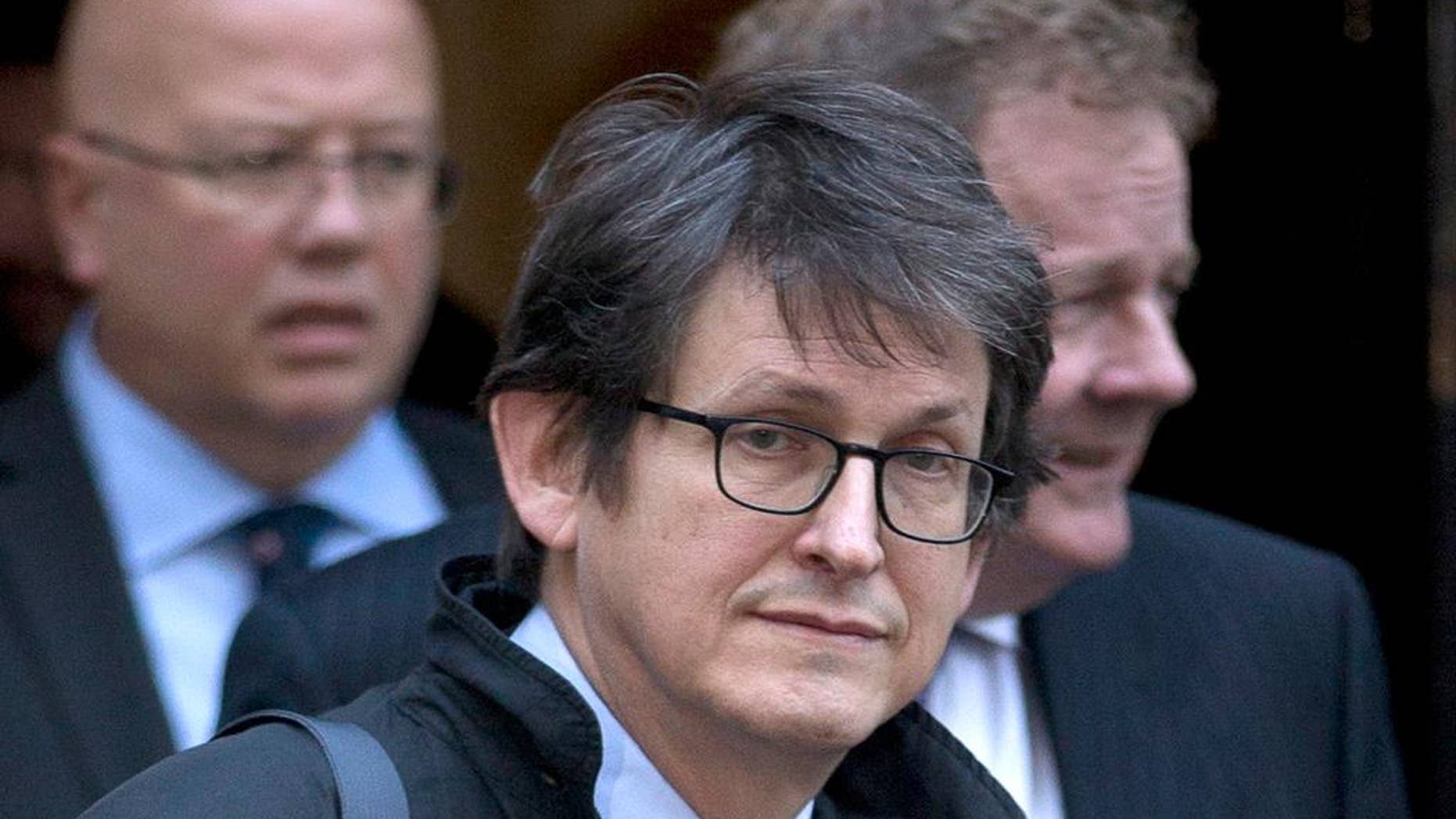 FILE - This Dec. 4, 2012 file photo shows Guardian newspaper editor Alan Rusbridger in London. Rusbridger the editor-in-chief of The Guardian newspaper said Wednesday Dec. 10, 2014, he will step down after 20 years in the role. Rusbridger said he would take over as chairman of The Scott Trust, which owns Guardian Media Group and was created to safeguard its journalistic freedom. Rusbridger’s leadership saw the paper expand from a Britain-only newspaper to an international media organization with a strong web presence. (AP Photo/Alastair Grant, File)