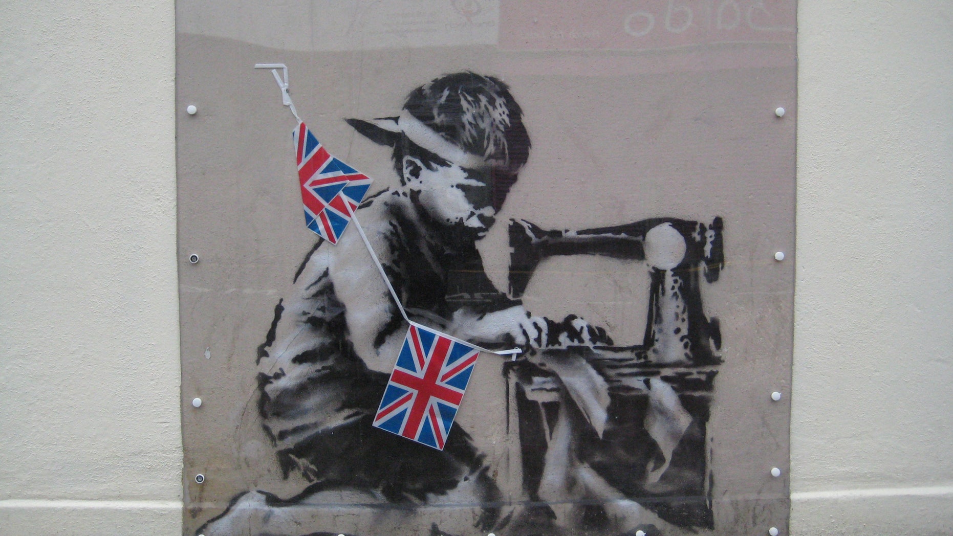 This is an undated image of an art work from British artist Banksy made available by Haringey Council Wednesday Feb. 20, 2013.