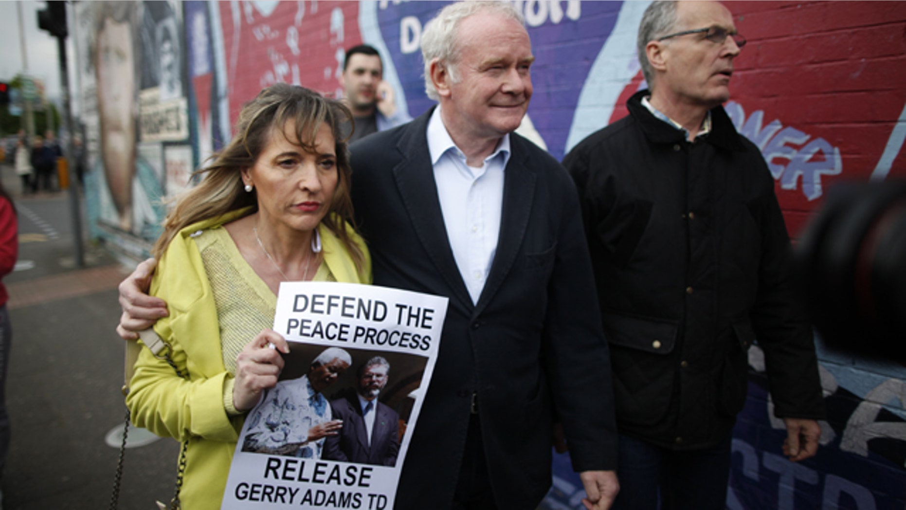May 3, 2014: Sinn Fein's Martin McGuinness, center, with party members Bobby Storey, right, and Martina Anderson as they arrive for a protest rally on the Falls Road, West Belfast, Northern Ireland.