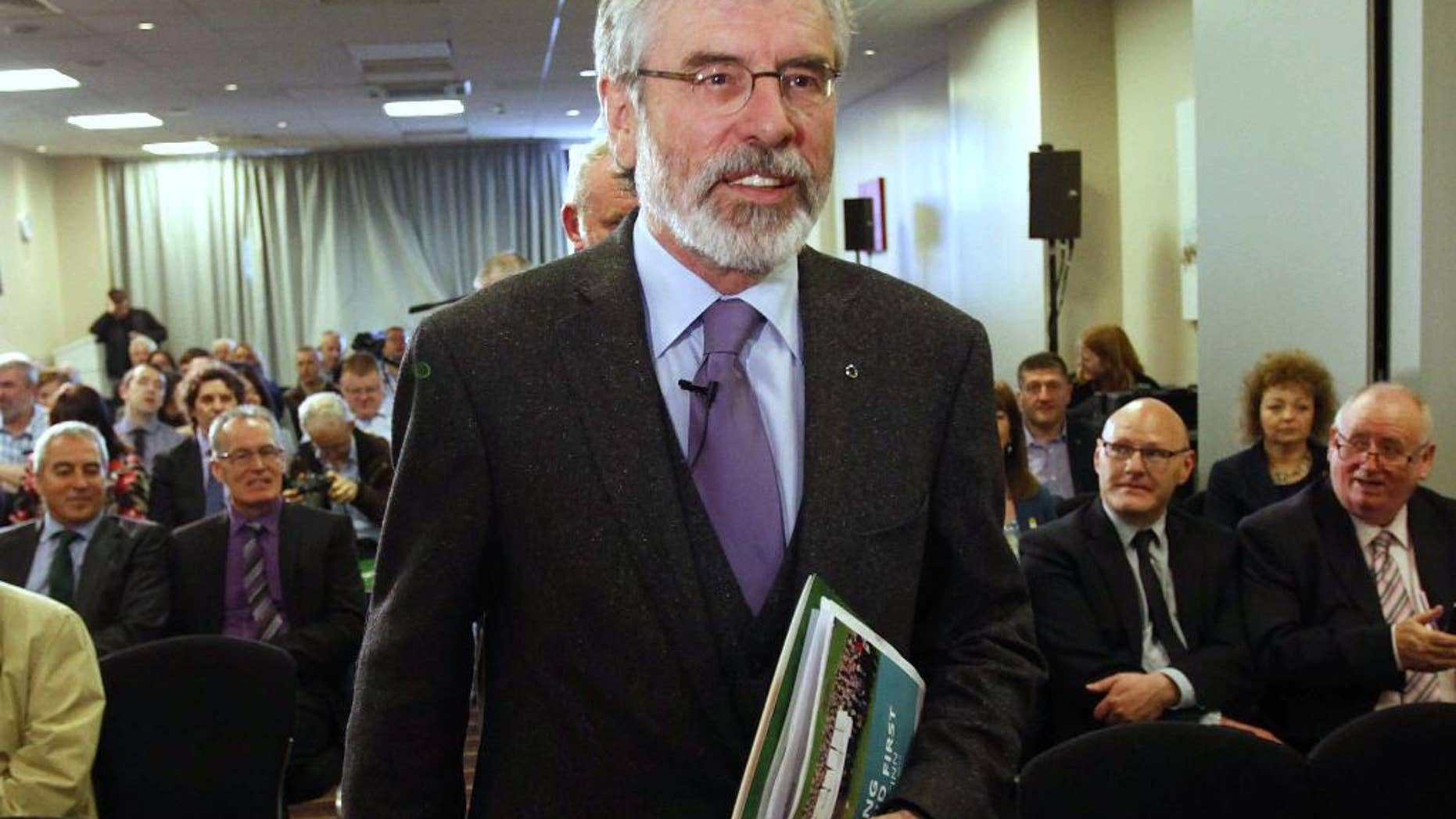 FILE - A Monday, May 12, 2014 photo from files showing Sinn Fein president Gerry Adams arriving for the launch of his party's EU manifesto in Belfast, Northern Ireland. Adams has denied new accusations that he concealed child-abuse crimes within his own secretive movement, this time allegedly committed by a Belfast officer of the outlawed Irish Republican Army. Mairia Cahill, a member of one of Belfast's top IRA families, appeared alongside a former foreign minister Thursday, Oct. 16, 2014, at Ireland's parliament to accuse Adams of conspiring to suppress her reports of being raped by the IRA commander from Adams' home district in 1997, when she was 16. (AP Photo/Peter Morrison, File)