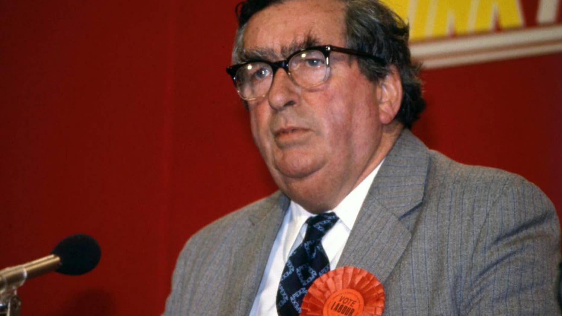 FILE - In this Sunday, May 1, 1983 file photo, British Labour Party spokesman on Foreign Affairs Denis Healey addresses a Labour Party news conference in London. Decorated World War II military hero and former British treasury chief Dennis Healey has died on Saturday, Oct. 3, 2015 after a long career in British politics. He was 98. His family said Healey, a Labour Party stalwart and member of the House of Lords, died Saturday morning at his home in Sussex after a brief illness. Healey was a towering figure on Britain’s political scene for several decades, known for his familiar bushy eyebrows, his forthright demeanor, and his wide-ranging interests, which included photography and the opera. (AP Photo/Joseph Schaber, file)
