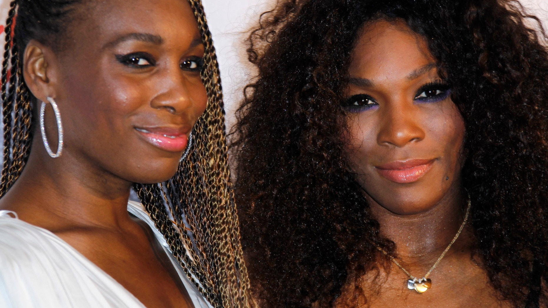The Williams sisters, pictured here at a pre-Wimbledon party on June 21, 2012, will attempt to extend their undefeated streak in doubles at this year's Olympics. (AP Photo)