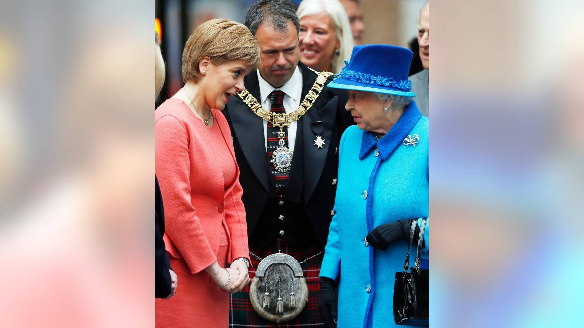 Britain's Queen Elizabeth II meets First Minister of Scotland Nicola Sturgeon, left, as she arrives at the opening ceremony for the Borders Railway route at Tweedbank station, Scotland, Wednesday Sept. 9, 2015. The Queen has today become the longest ever reigning monarch in British history surpassing Queen Victoria who served for 63 years and seven months. Danny Lawson / PA via AP) UNITED KINGDOM OUT - NO SALES - NO ARCHIVES