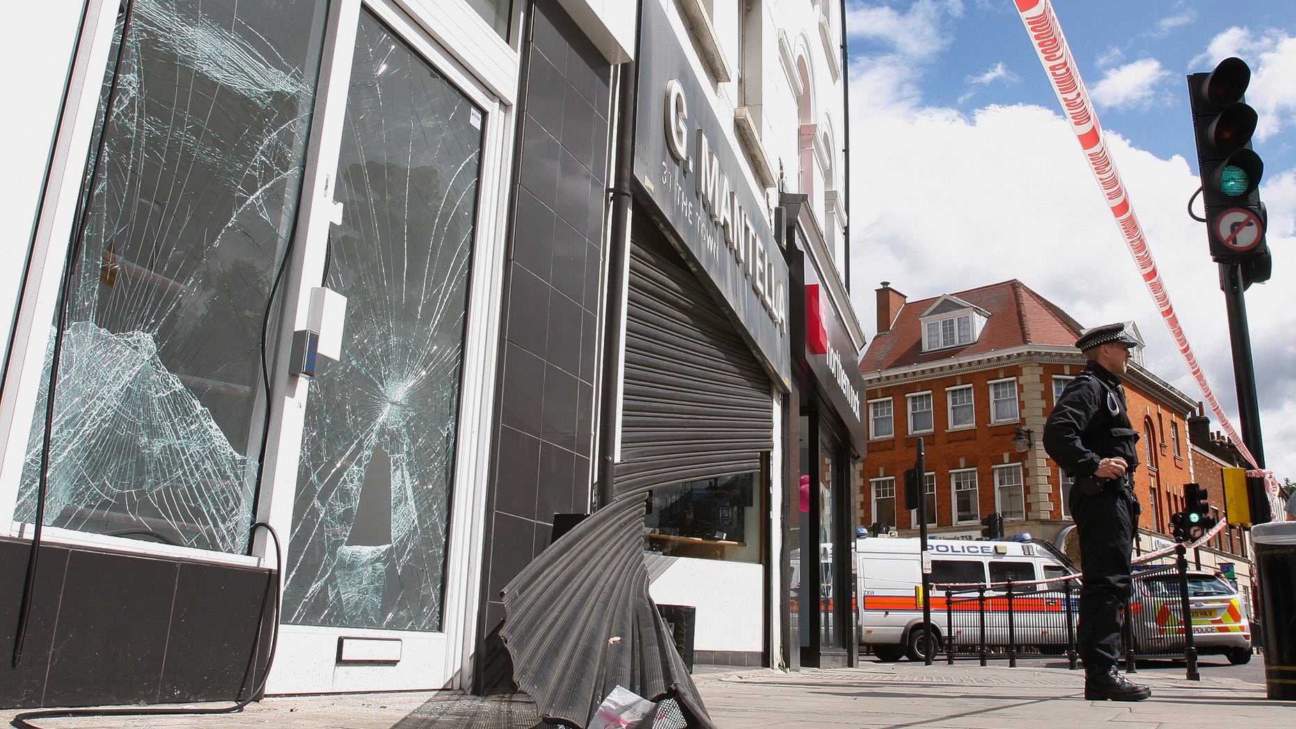 August 8: Smashed glass doors and windows and wrecked shutters on the shop front of a betting shop and a jewelry shop in Enfield, north London. British police on Monday promised a "momentous operation" to arrest rioters after a weekend of vandalism and looting that erupted in a disadvantaged London neighborhood just miles (kilometers) from the site of next year's Olympic Games.
