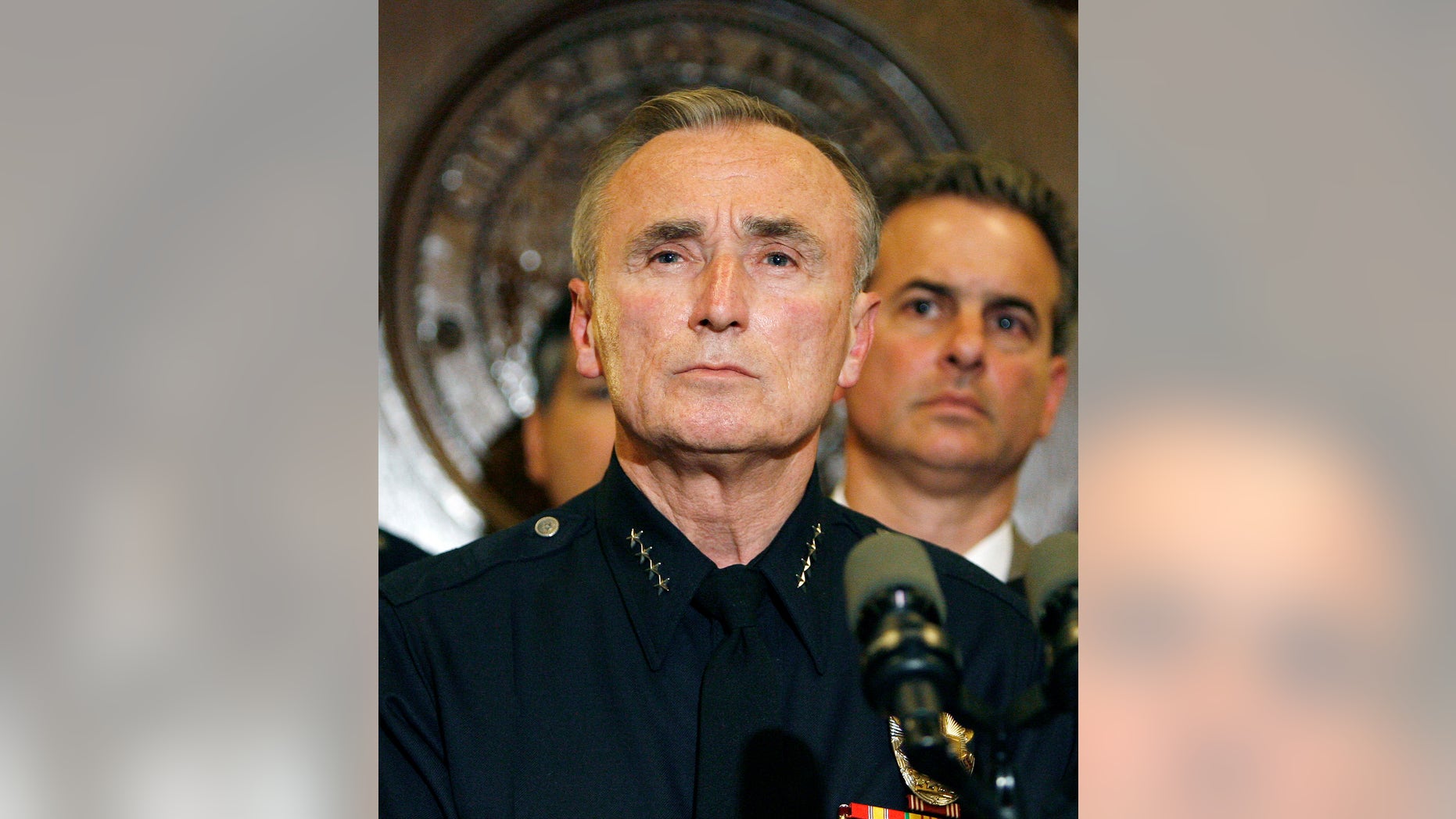 May 2, 2007: Former Los Angeles Police Chief William J. Bratton, left, takes a question during a news conference with city leaders at Los Angeles City Hall. Britain's Prime Minister David Cameron said Thursday his country would look to the United States for solutions to gang violence after nights of riots and looting.