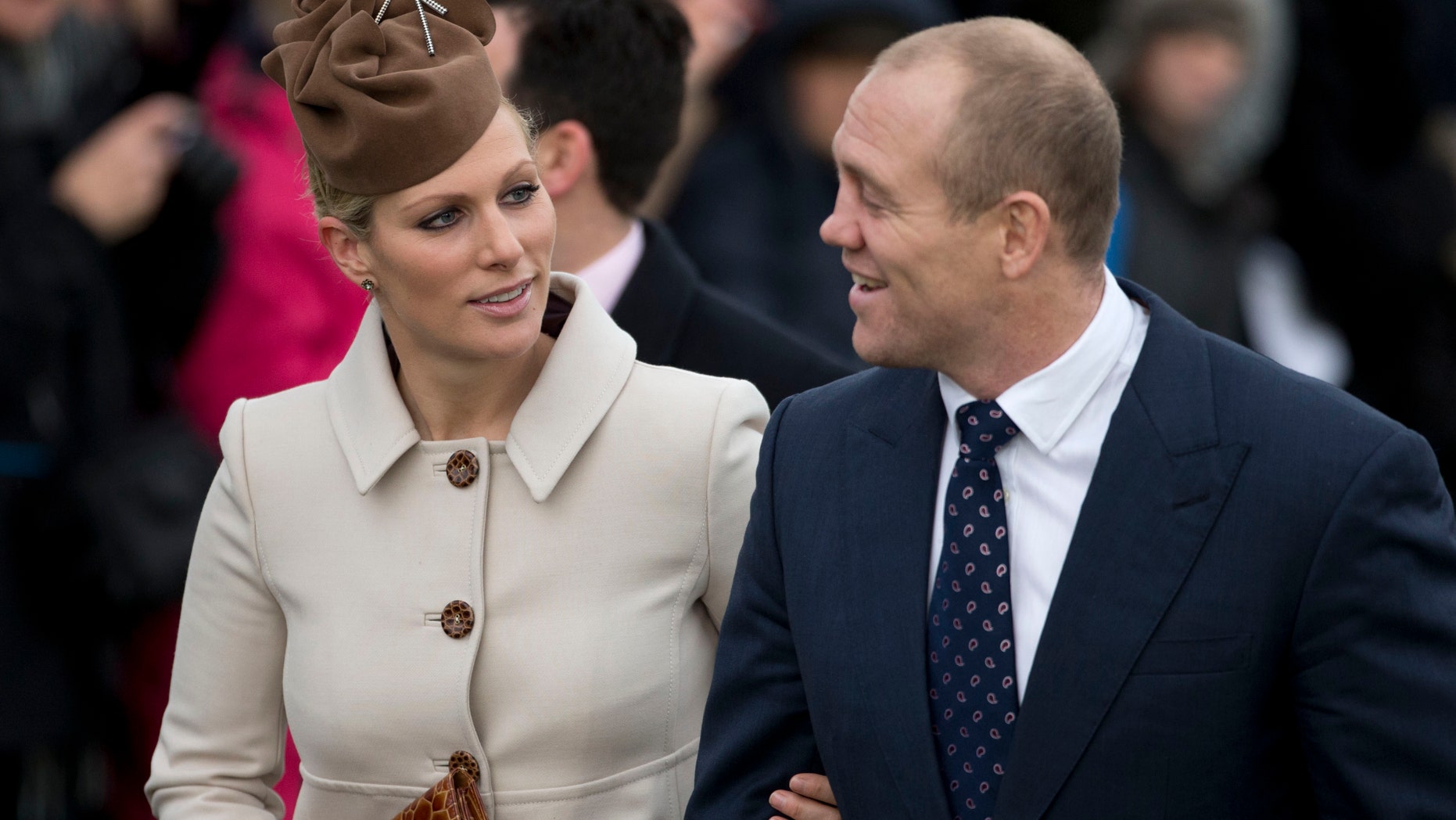 Dec. 25, 2012 - FILE photo of Zara Phillips and husband rugby player Mike Tindall at a Christmas Day church service in Sandringham, England. Buckingham Palace announced Friday that Queen Elizabeth II' s granddaughter Zara Phillips had given birth to a baby girl at Gloucestershire Royal Hospital.