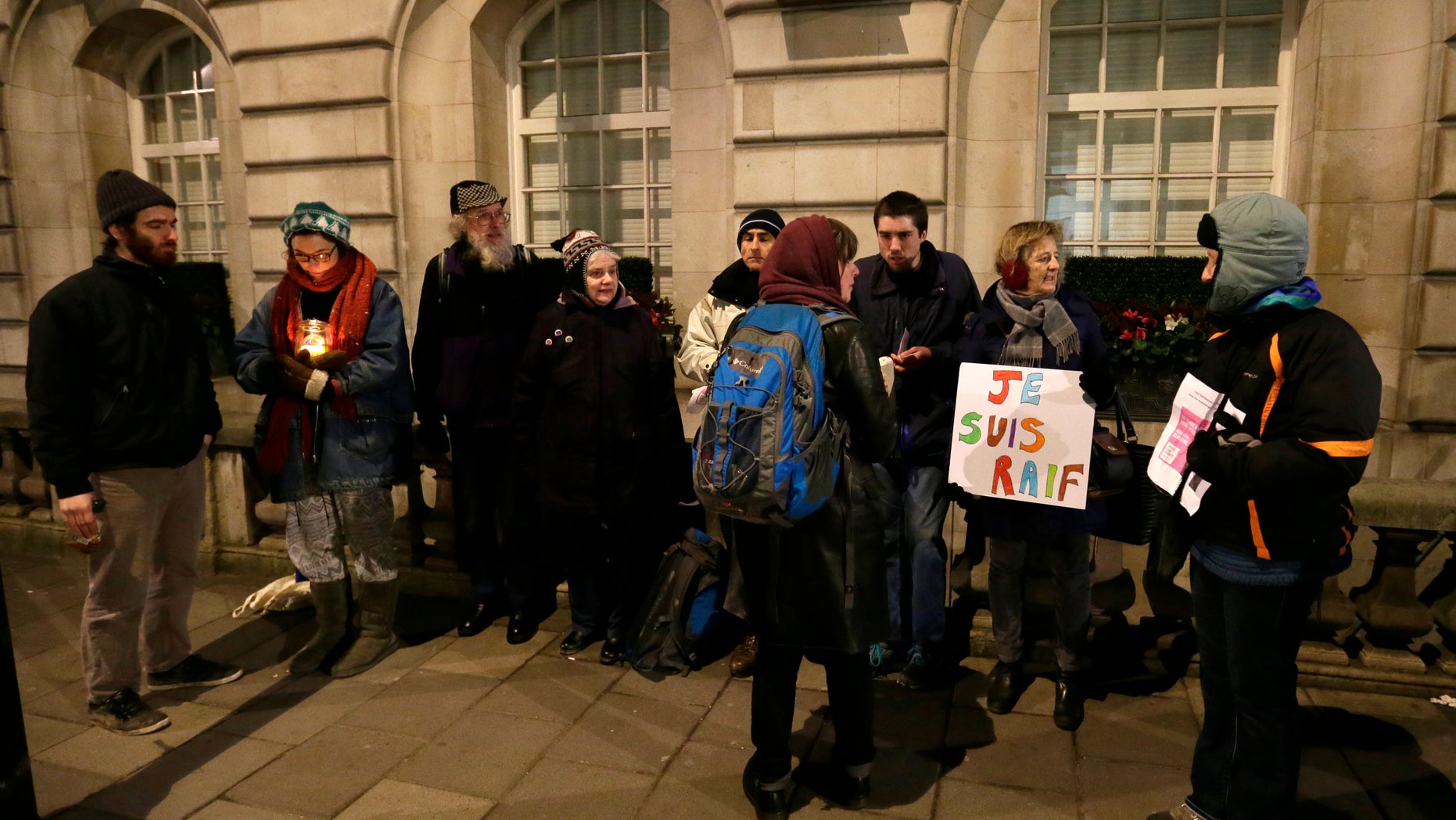 Jan. 23, 2015 - Demonstrators outside London's Royal Embassy of Saudi Arabia protesting the planned flogging of Saudi blogger Raif Badawi who was convicted in Saudi Arabia of insulting Islam. A leading rights group says Saudi authorities have delayed Friday's planned flogging of Badawi for a 3rd straight week in the face of growing international pressure against the punishment.