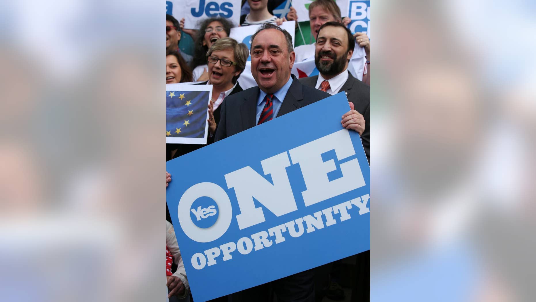 Scottish First Minister Alex Salmond meets with Scots and other European citizens to celebrate European citizenship and "Scotland's continued EU membership with a Yes vote" at Parliament Square in Edinburgh, Scotland, Tuesday, Sept. 9, 2014. Opinion polls showing that the independence referendum in Scotland is too close to call have prompted widespread selling of the British pound. If the actual vote on Sept. 18 delivers a knockout blow to Scotland’s 307-year union with England, that selling could become even more pronounced as the United Kingdom is likely plunged into the biggest constitutional crisis in its history. The fate of the British pound, which has been one of the most tangible links of the union, will be front and center of the separation proceedings as it has been for the past few months during the cut and thrust of the campaign. (AP Photo/Andrew Milligan, PA Wire) UNITED KINGDOM OUT - NO SALES - NO ARCHIVES