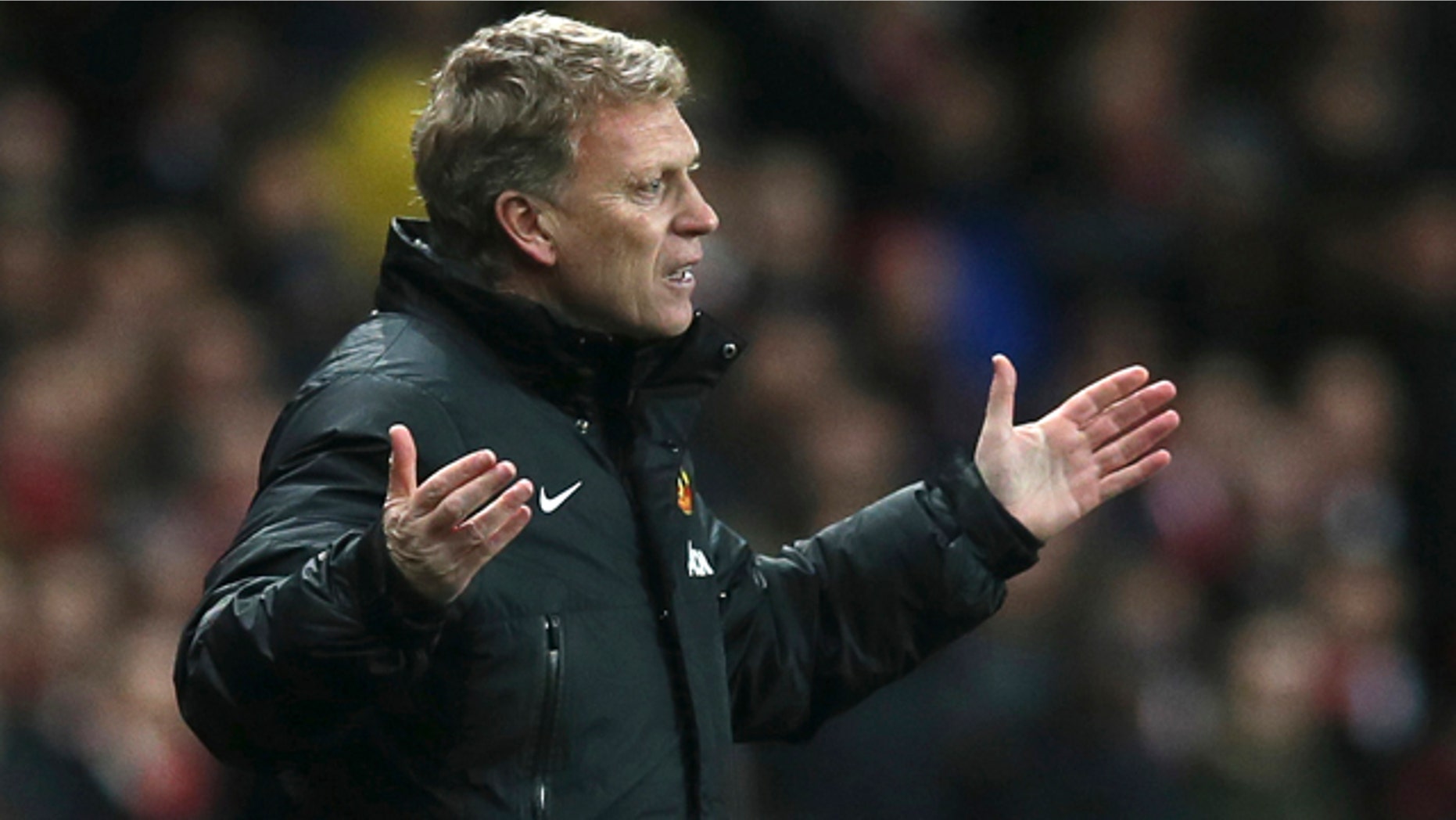 FILE - In this Wednesday, Feb. 12, 2014 file photo Manchester United's manager David Moyes gestures to his team during their English Premier League soccer match between Arsenal and Manchester United at the Emirates stadium in London. Manchester United says manager David Moyes has left the Premier League club after less than a year in charge, amid heavy speculation he was about to be fired. (AP Photo/Alastair Grant, File)