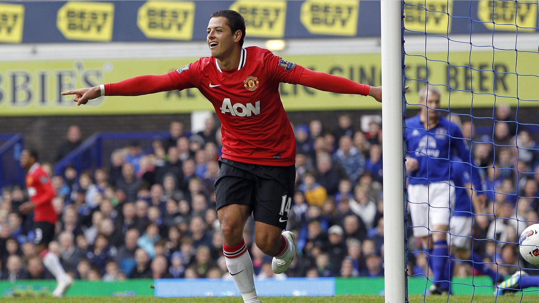 Manchester United's Javier Hernandez celebrates scoring against Everton during the English Premier League soccer match at Goodison Park, Liverpool, England, Saturday Oct. 29, 2011. Manchester United won the match 1-0. (AP Photo/PA, Peter Byrne) UNITED KINGDOM OUT