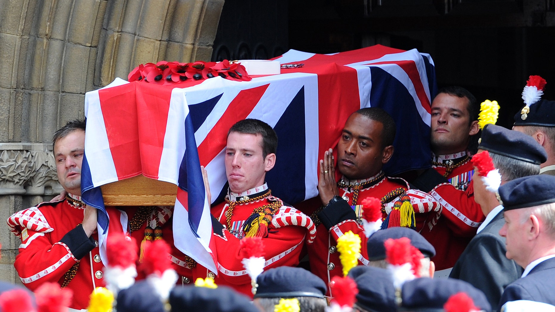 July 12, 2013 - The coffin of murdered Fusilier Lee Rigby is carried by soldiers after his funeral service at Bury Parish church in Greater Manchester, England. Relatives of the British soldier killed in broad daylight by alleged Islamic extremists say they are deeply grateful for the support they have received from the public. Rigby was hacked to death May 22 on a London street near his army barracks.