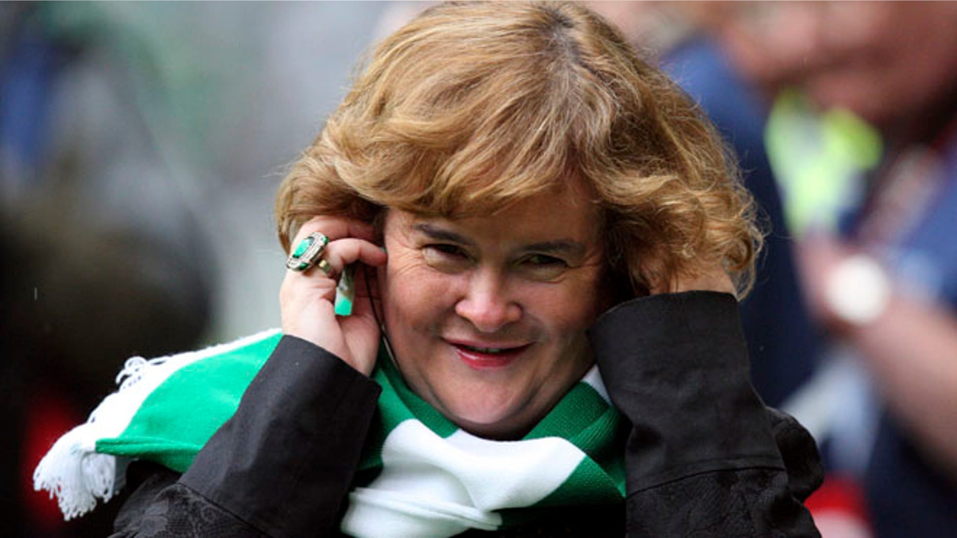 FILE - Susan Boyle performs ahead of the Champions League qualifying second round soccer match between Celtic and Helsingborgs at Celtic Park, Glasgow, Scotland, in this Aug. 29, 2012 file photo. Boyle told the Observer newspaper in an interview published Sunday Dec. 8, 2013, she has been diagnosed with Asperger's syndrome, a form of autism, after seeing a specialist a year ago. (AP Photo/Scott Heppell, File)