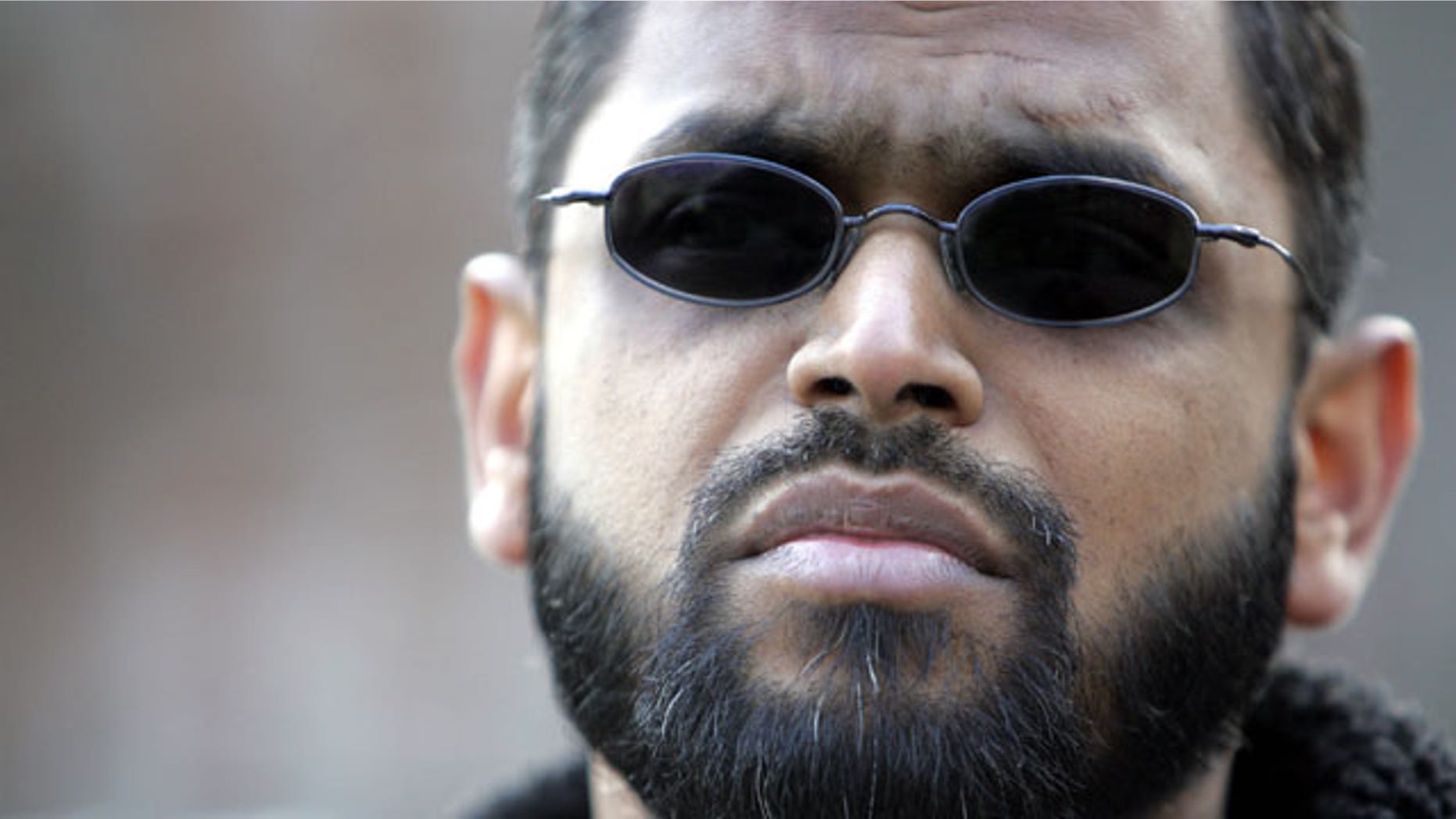 FILE - March 3, 2006: Moazzam Begg outside the United States Embassy in London. British police say Begg is one of four people arrested on suspicion of Syria-related terrorism offenses in the Birmingham area of central England. Police say 45-year-old Begg is suspected of attending a terrorist training camp and facilitating terrorism overseas. (AP Photo/Alastair Grant, File)