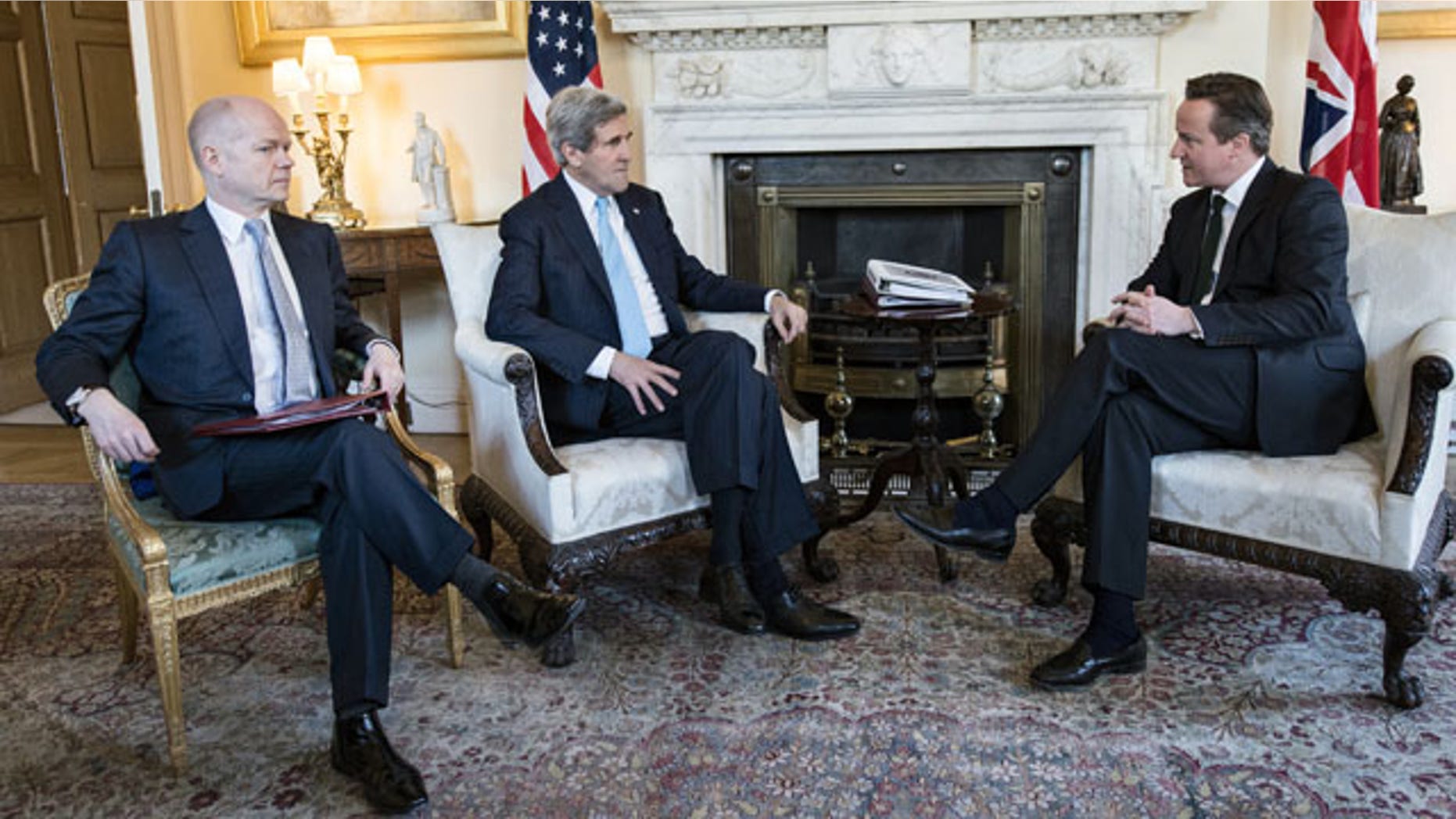 March 14, 2014: Britain's Prime Minister David Cameron, right, and Foreign Secretary William Hague, left, meet with US Secretary of State John Kerry in Downing Street, central London. (AP Photo/Brendan Smialowski, Pool)