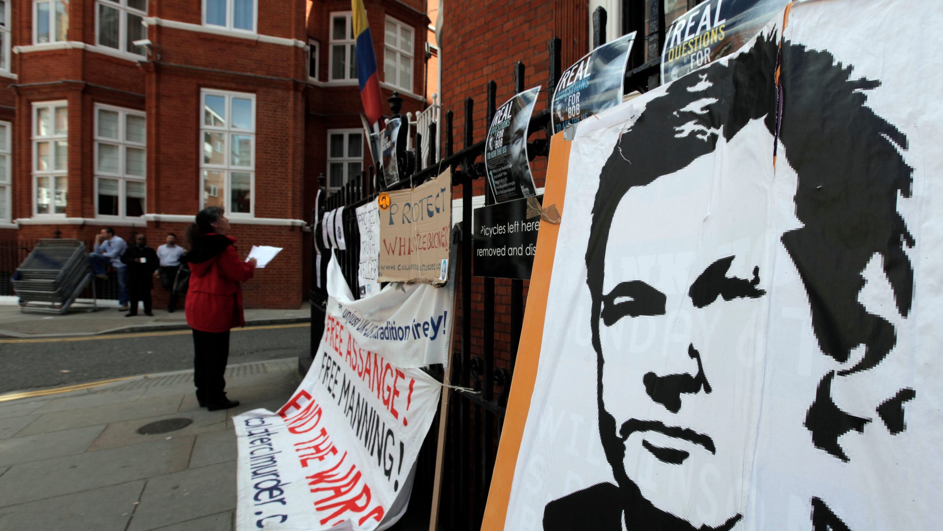 Placards and messages placed by supporters of WikiLeaks founder Julian Assange, are seen outside the Ecuador Embassy, London, Friday, June 29, 2012. Assange had entered the embassy in an attempt to gain political asylum to prevent him from being extradited to Sweden to face allegations of sex crimes, which he denies. (AP Photo/Lefteris Pitarakis)