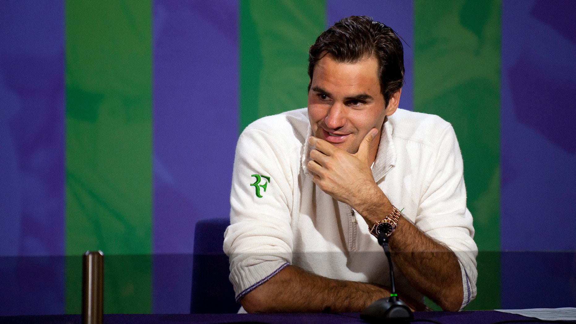 July 8, 2012: Roger Federer speaks during a news conference after he won the men's singles final against Andy Murray of Britain at the All England Lawn Tennis Championships, Wimbledon, England.