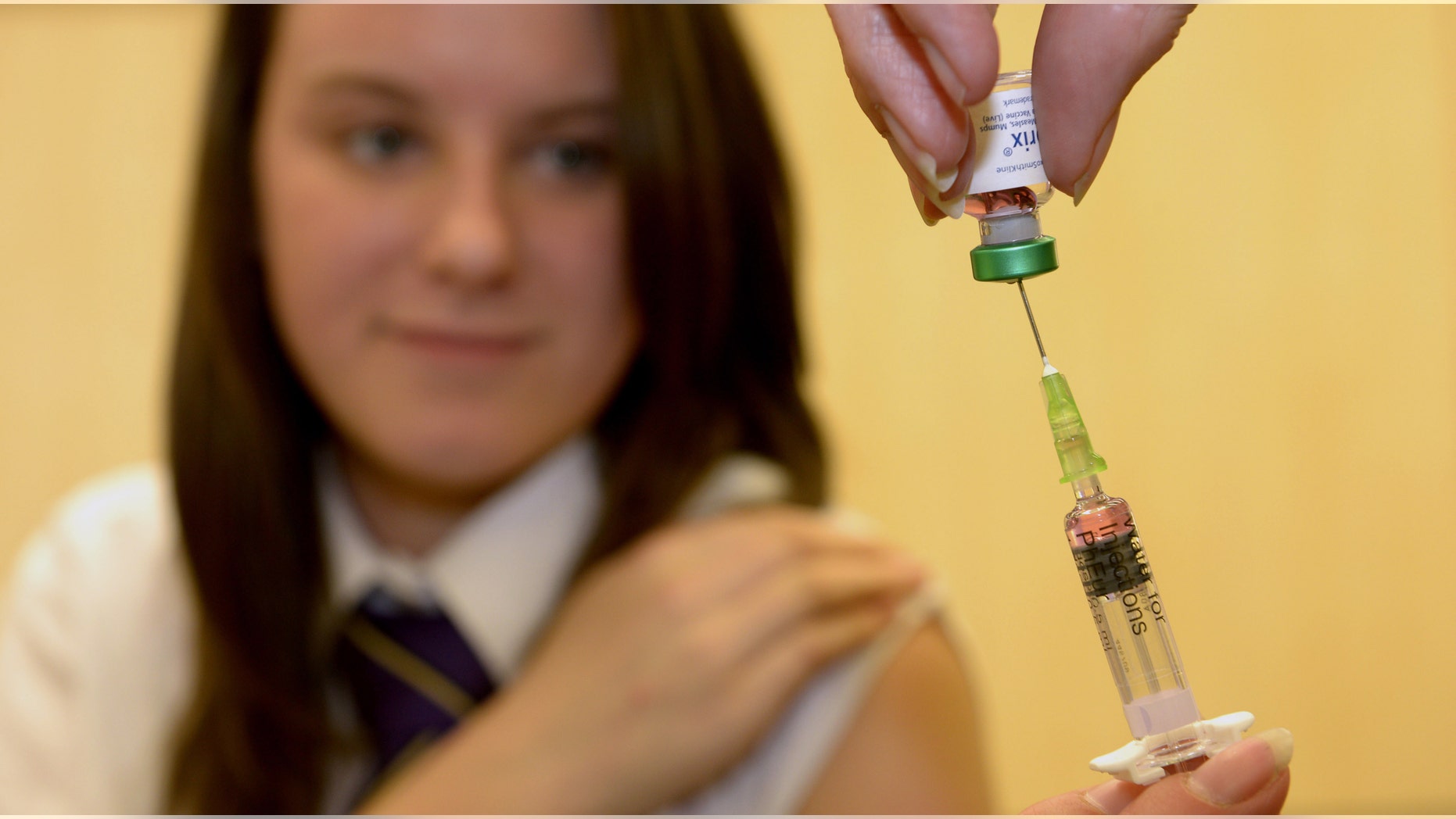 Lucy Butler,15, gets ready to have her measles shot at All Saints School in Ingleby Barwick, Teesside, England, as a national vaccination catch-up campaign has been launched to curb a rise in measles cases in England.