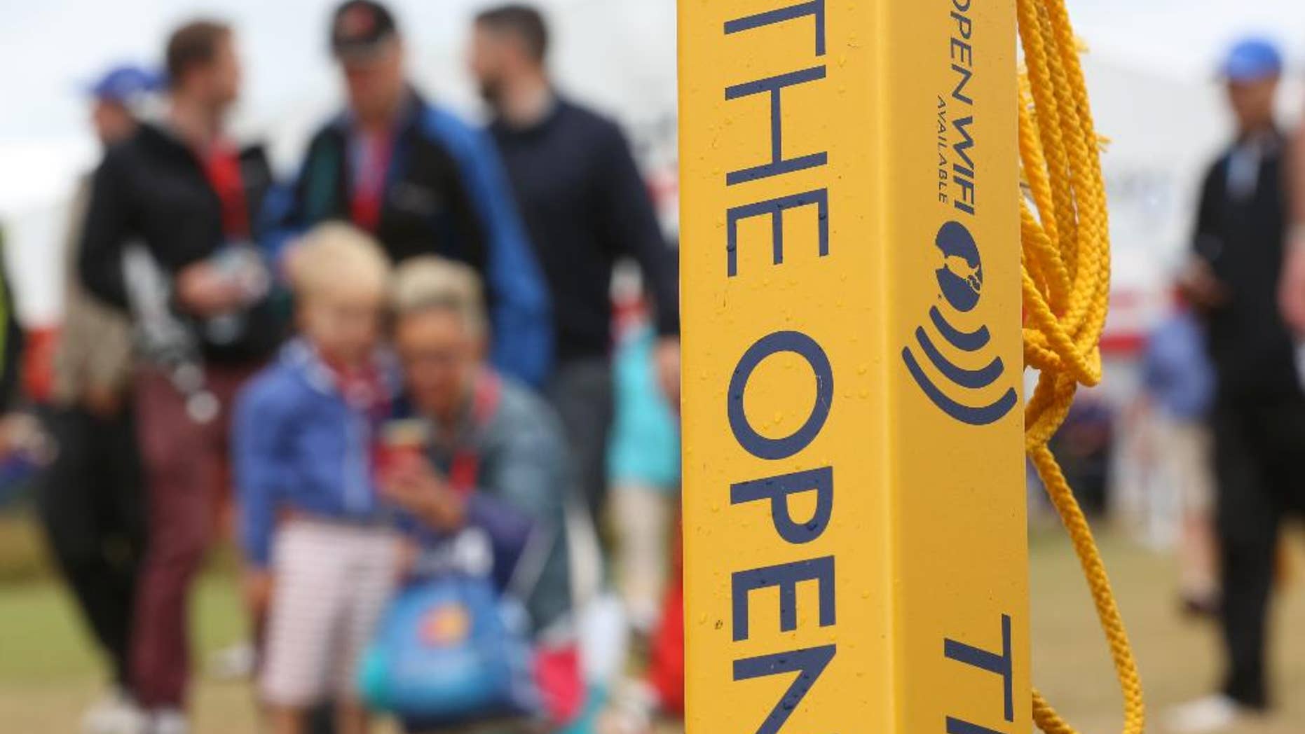 A sign advertising WiFi near the 3rd hole on the course at the Royal Liverpool golf club where the British Open Golf championship will start Thursday July 17, in Hoylake, England, Wednesday July 16, 2014. (AP Photo/Jon Super)