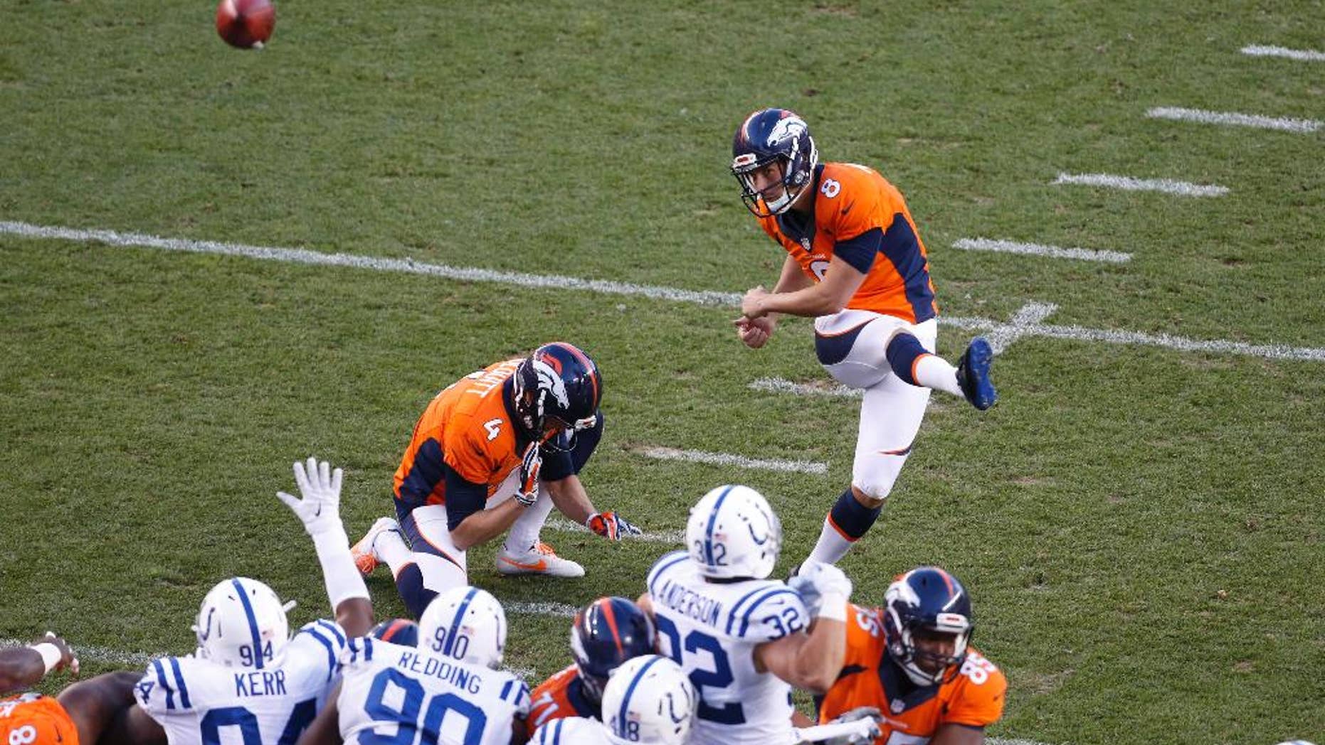 FILE - In this Sept. 7, 2014, file photo, Denver Broncos kicker Brandon McManus (8) kicks against the Indianapolis Colts during the first half of an NFL football game in Denver. McManus is making the most of his NFL tryout while Pro Bowler Matt Prater serves out his four-game suspension kicking field goals at a nearby high school. The Broncos traded a conditional 2015 seventh-round pick to the New York Giants for McManus last month after Prater was suspended for drinking. Prater has been in the NFL's drug program, which includes alcohol, since a DUI arrest in 2011. (AP Photo/Brennan Linsley, File)