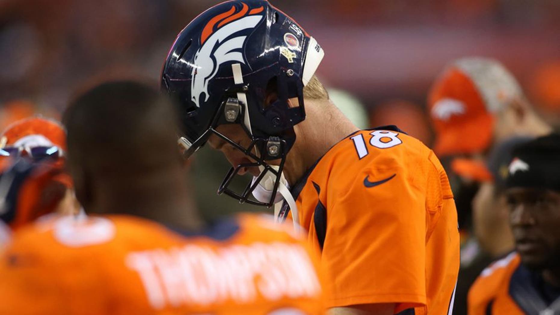 Nov 15, 2015; Denver, CO, USA; Denver Broncos quarterback Peyton Manning (18) reacts on the sidelines during the second half against the Kansas City Chiefs at Sports Authority Field at Mile High. The Chiefs won 29-13. Mandatory Credit: Chris Humphreys-USA TODAY Sports