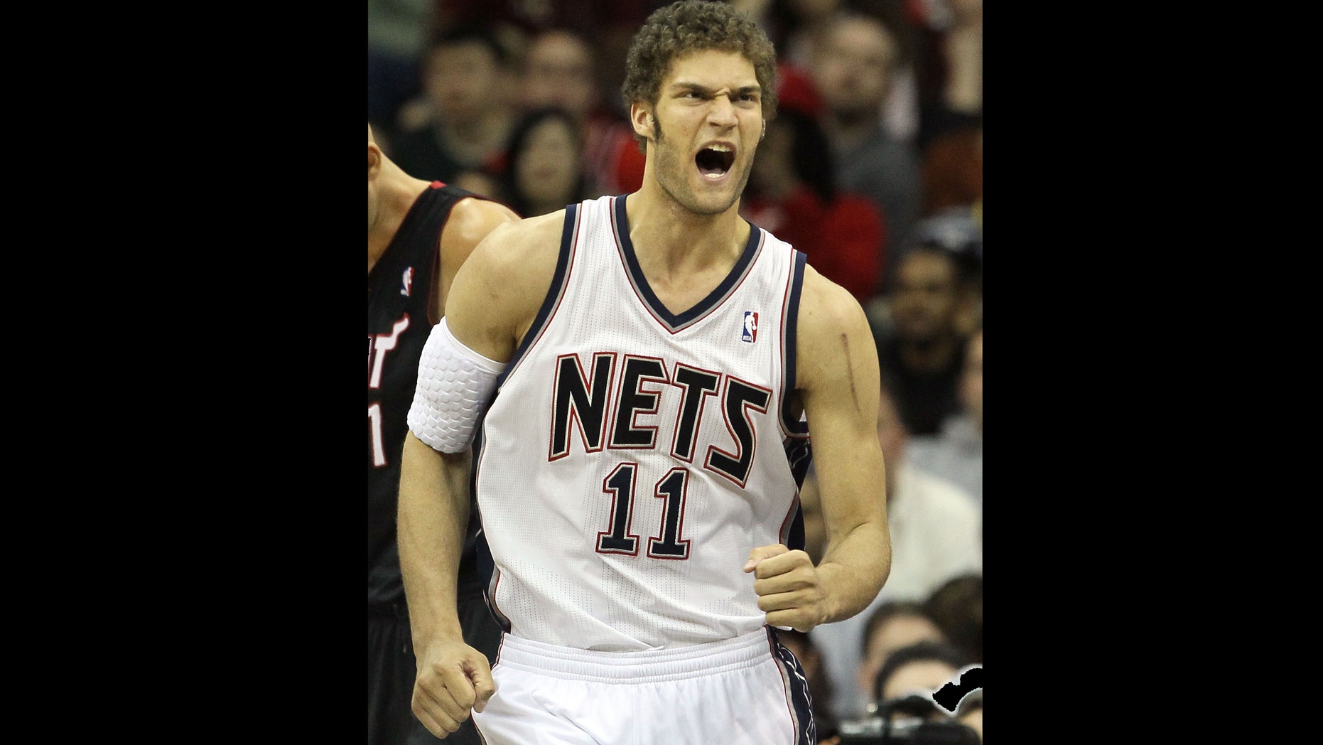 NEWARK, NJ - APRIL 03: Brook Lopez #11 of the New Jersey Nets reacts against the Miami Heat at the Prudential Center on April 3, 2011 in Newark, New Jersey.The Heat defeated the Nets 108-94.