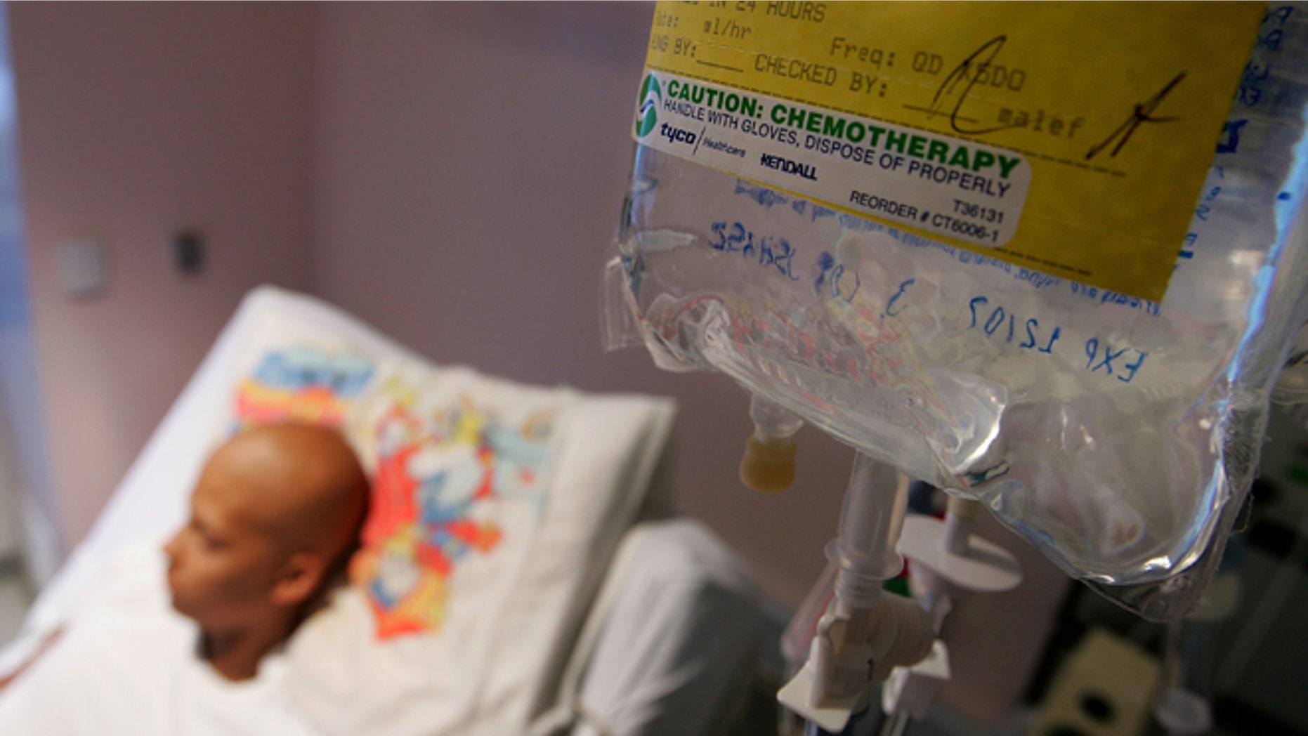 SAN FRANCISCO - AUGUST 18: Eighteen-year-old cancer patient Patrick McGill lies in his hospital bed while receiving IV chemotherapy treatment for a rare form of cancer at the UCSF Comprehensive Cancer Center Childrens Hospital August 18, 2005 in San Francisco, California. The UCSF Comprehensive Cancer Center continues to use the latest research and technology to battle cancer and was recently rated 16th best cancer center in the nation by US News and World Report. (Photo by Justin Sullivan/Getty Images)