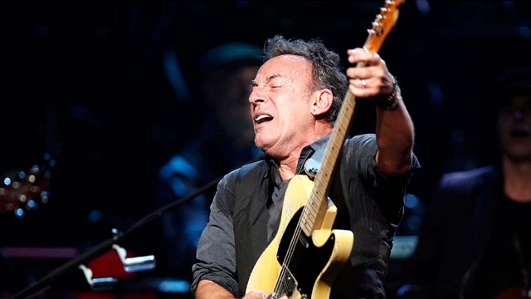 Bruce Springsteen and the E Street Band perform onstage during SiriusXM's 10th anniversary celebration at the Apollo Theater in Harlem, New York March 9, 2012. REUTERS/Carlo Allegri (UNITED STATES - Tags: ENTERTAINMENT)