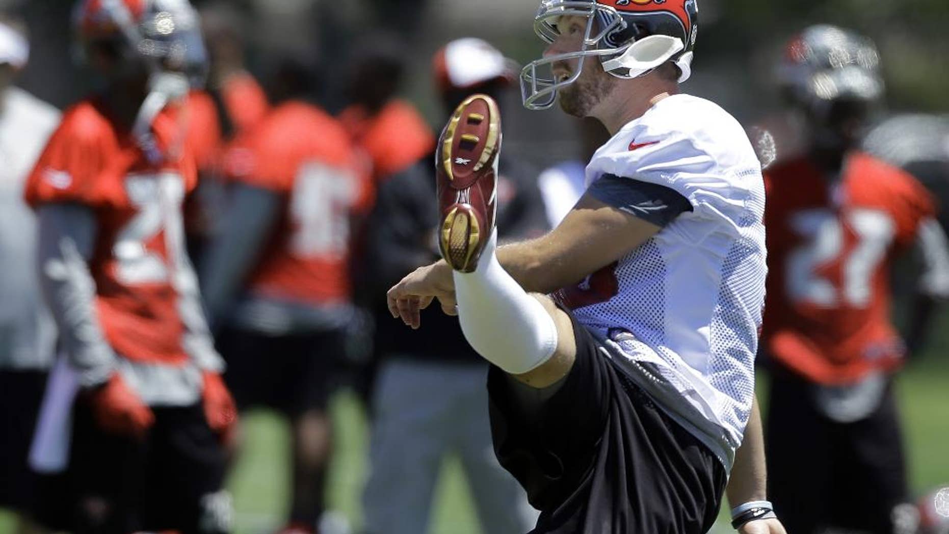 In this April 23, 2014 photo, Tampa Bay Buccaneers' Connor Barth follows through on a kick during a voluntary minicamp NFL football practice in Tampa, Fla. Barth never doubted he'd kick again for the Tampa Bay Buccaneers. The sixth-year pro missed all of last season after rupturing the Achilles tendon in his right foot during a charity basketball game, and he's confident he'll return as good as ever in 2014. (AP Photo)