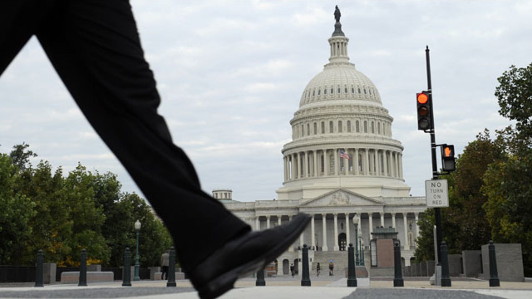 October 1, 2013: People walk near Capitol Hill in Washington. (AP Photo)