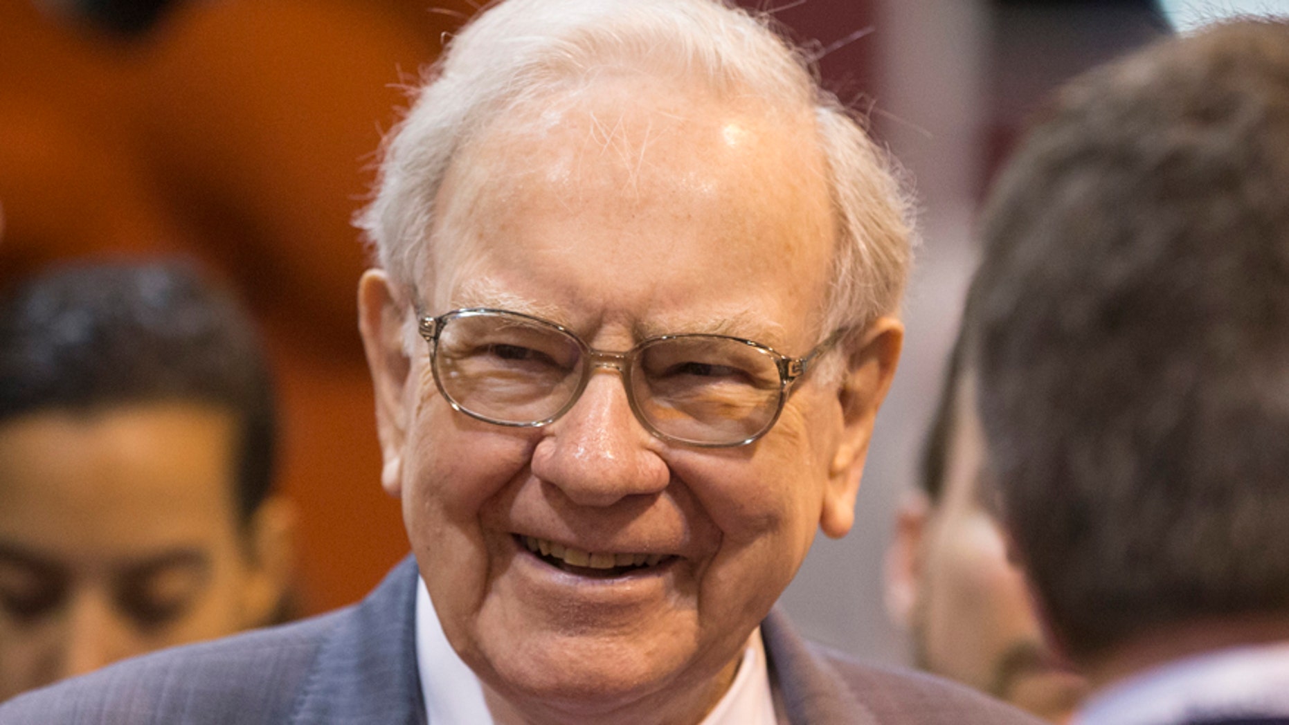 FILE - In this May 2, 2015, file photo, Berkshire Hathaway Chairman and CEO Warren Buffett smiles while touring the exhibit floor before presiding over the annual shareholders meeting in Omaha, Neb.