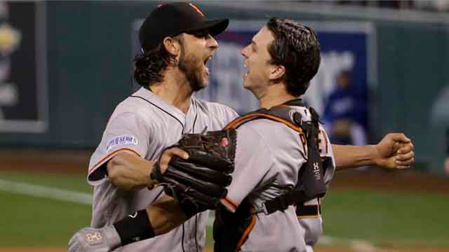 October 29 ,2104: San Francisco Giants pitcher Madison Bumgarner, left, and Buster Posey celebrate after defeating the Kansas City Royals in Game 7 of baseball's World Series in Kansas City, Mo. (AP Photo/Matt Slocum)