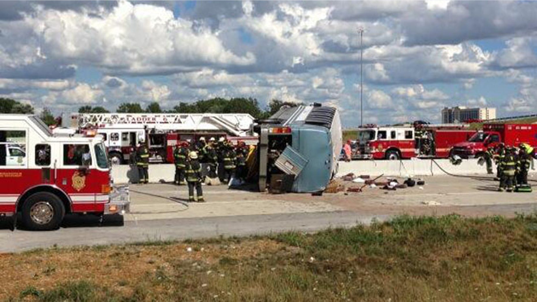 July 27, 2013: Authorities attend to an overturned bus that crashed on Interstate 465, killing three people.