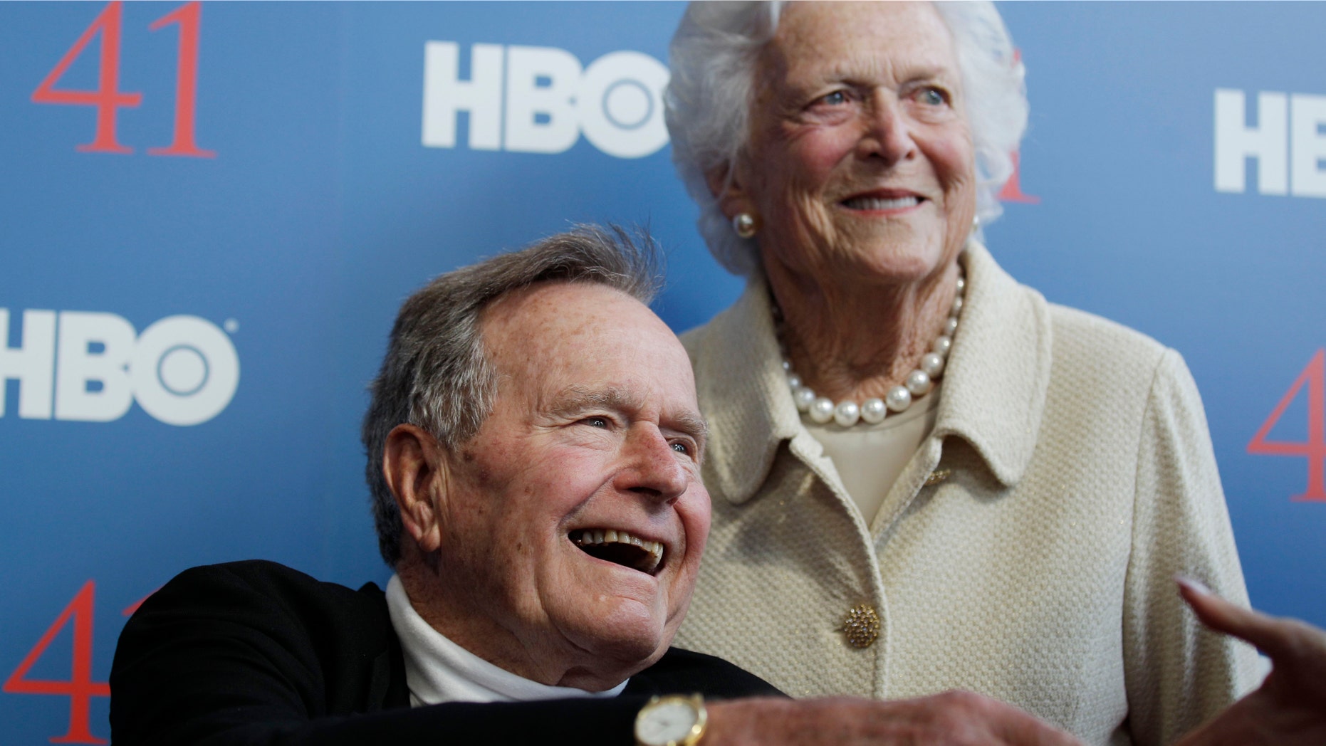 FILE - In a Tuesday, June 12, 2012 file photo, former President George H.W. Bush, and his wife, former first lady Barbara Bush, arrive for the premiere of HBO's new documentary on his life near the family compound in Kennebunkport, Maine. Bush spokesman Jim McGrath said Wednesday, Dec. 26. 2012 that doctors at the Houston hospital where Bush has been treated for a month remain cautiously optimistic that he will recover. Still, no discharge date has been set, and McGrath says that doctors are being cautious because at Bushs age sometimes issues crop up that are beyond anybodys ability to discern or foretell.(AP Photo/Charles Krupa, File)