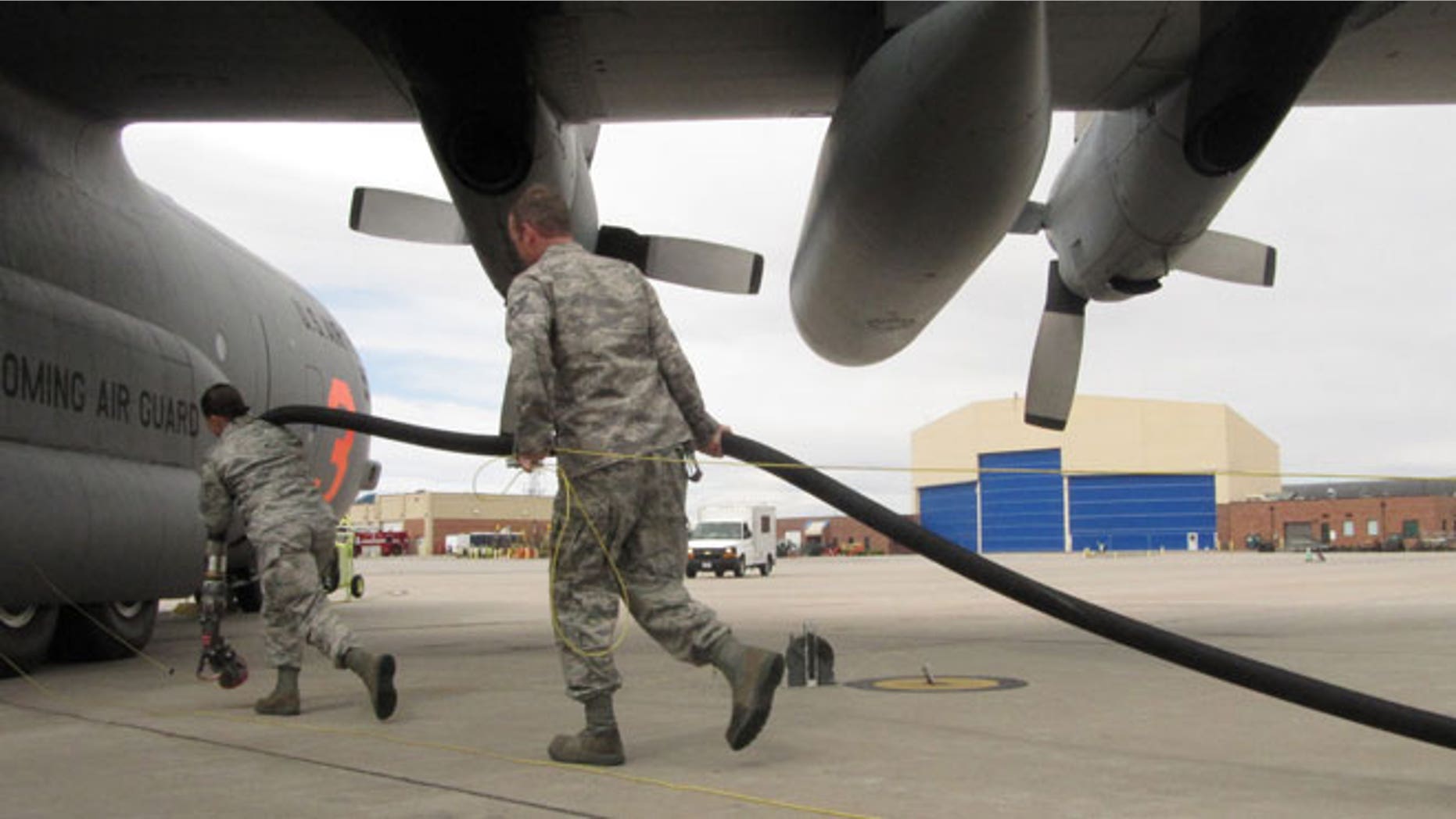 In this Wednesday April 18,2012 file photo Wyoming Air National Guard members are shown training in Cheyenne, Wyo., on using C-130 transport planes to drop fire retardant at wildfires.
